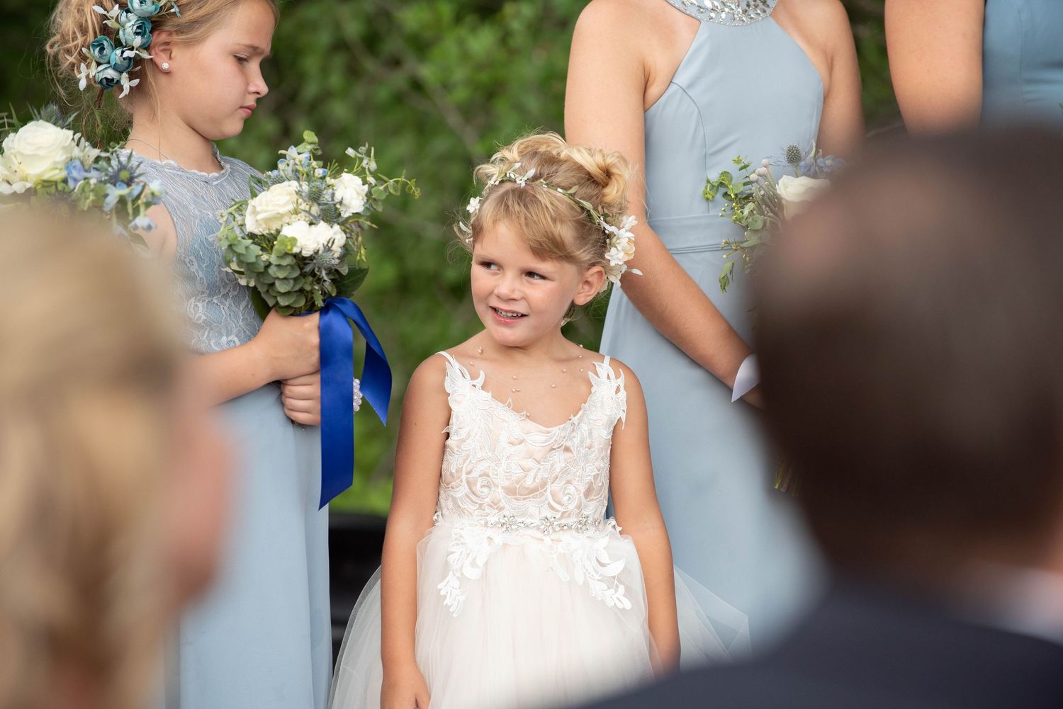 Wedding celebration in progress with light blue accents and natural woodland setting. Zimmerman MN Weddings