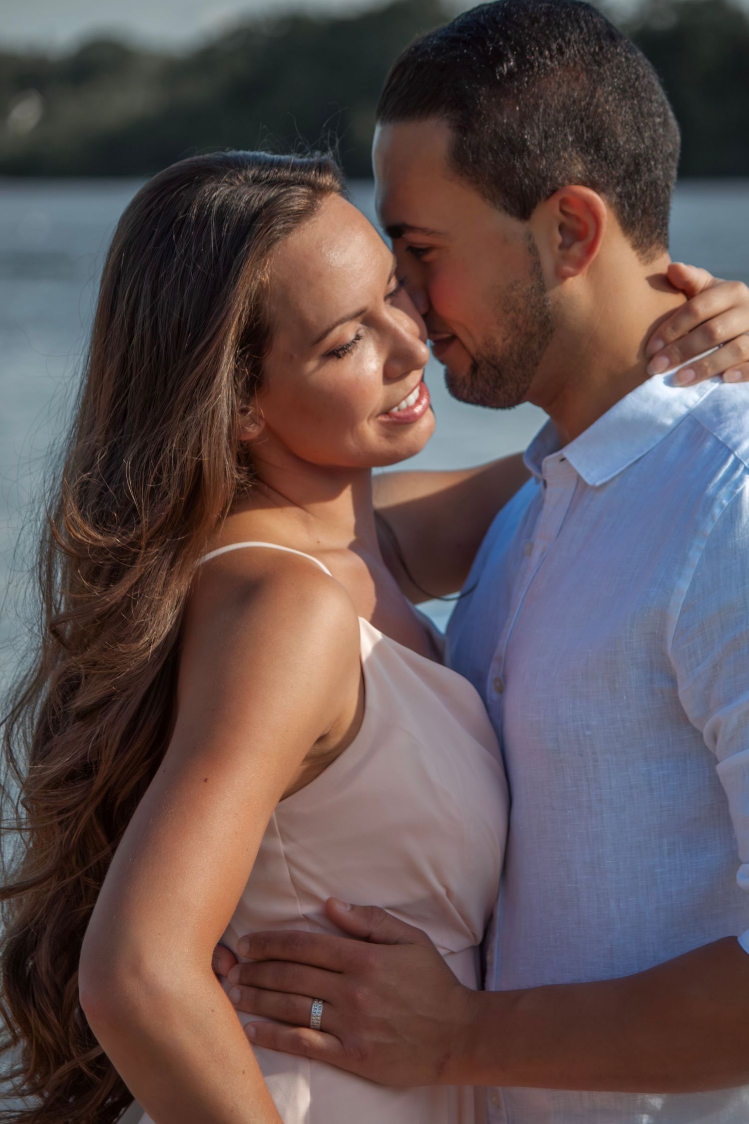 Intimate beachside couple portraits at golden hour.