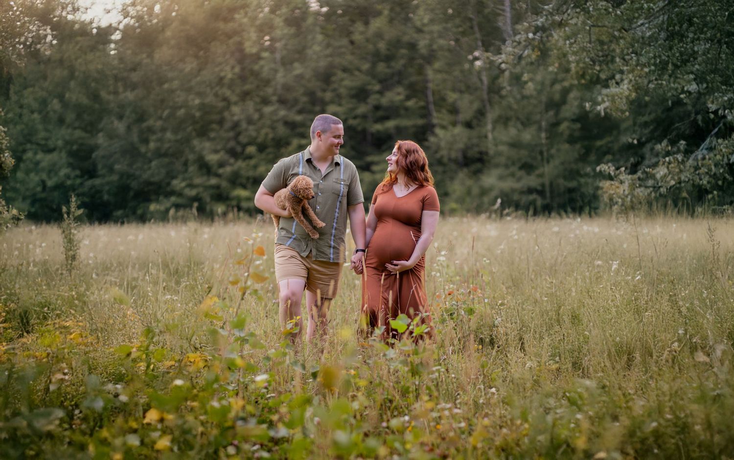 Family enjoying a casual stroll through a blooming meadow on a sunny afternoon.