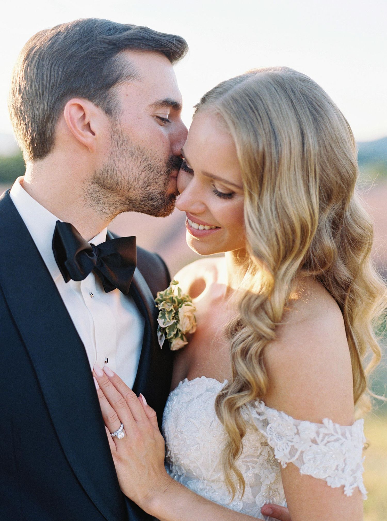 Romantic wedding portrait in Provence, France, featuring a bride and groom sharing an intimate moment in natural light.