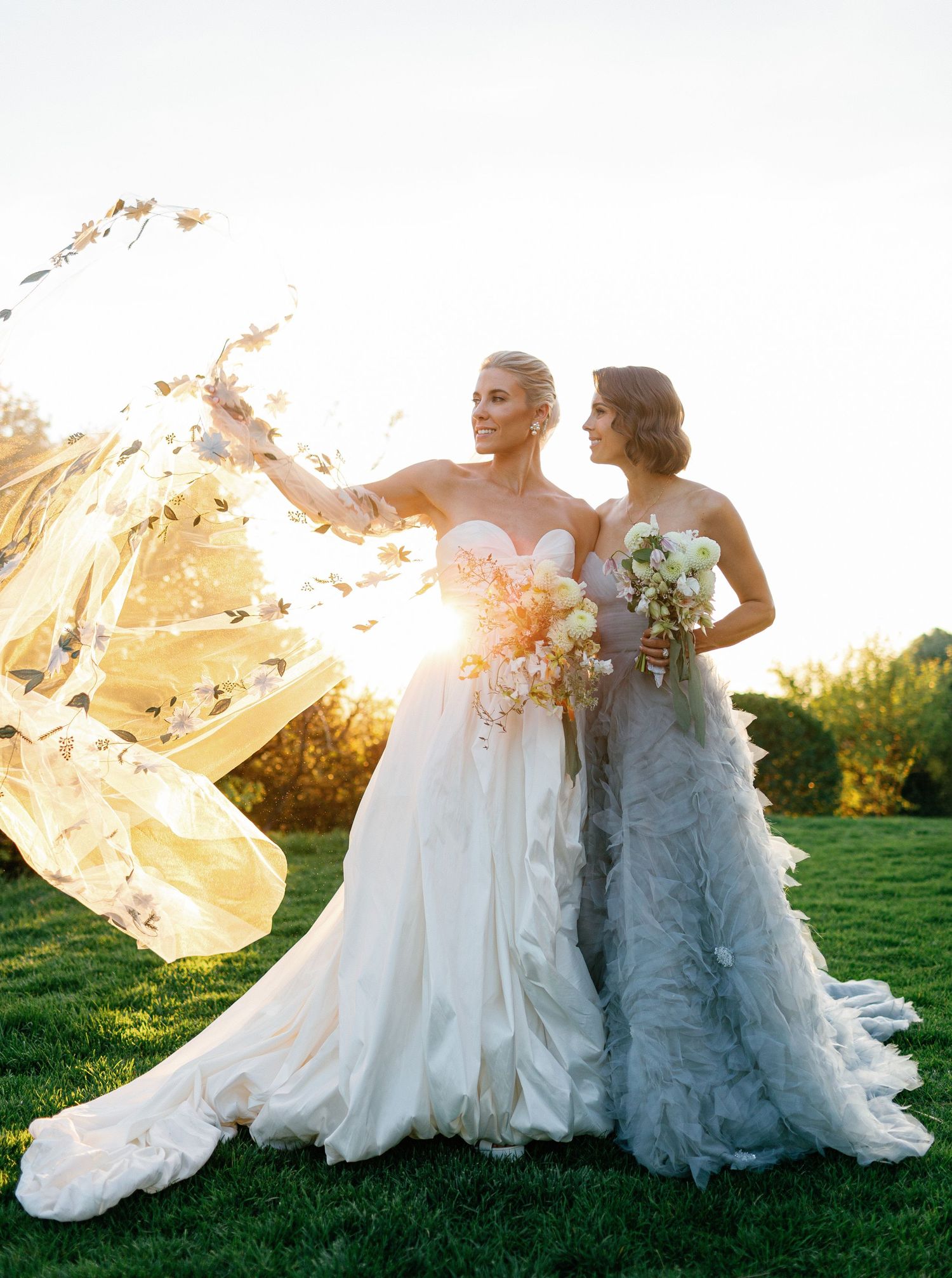 Same-sex wedding portrait of two brides at Capelongue in Provence at golden hour.