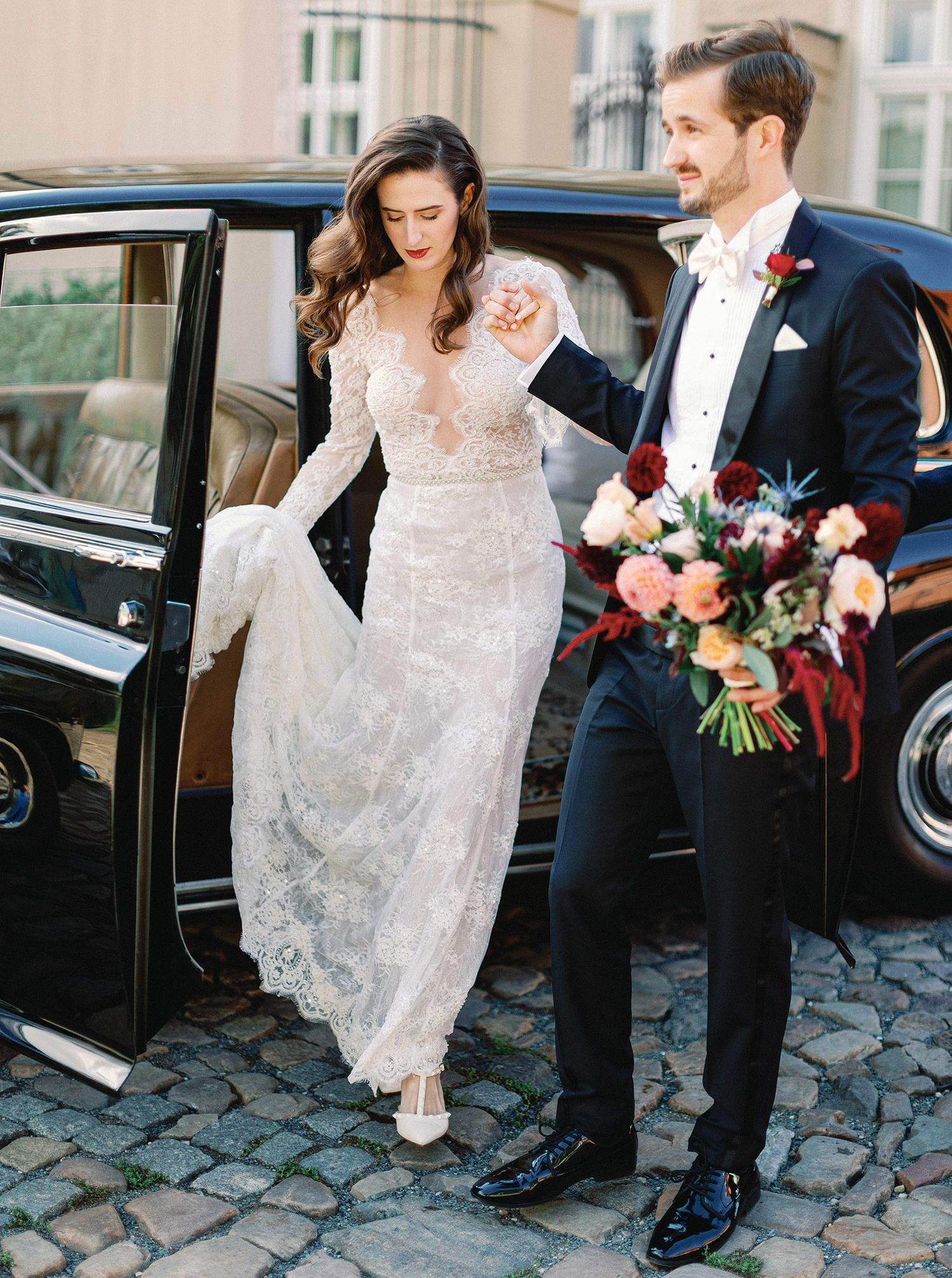 Elegant bride and groom at Four Seasons, Prague, showcasing timeless wedding style and sophisticated charm.