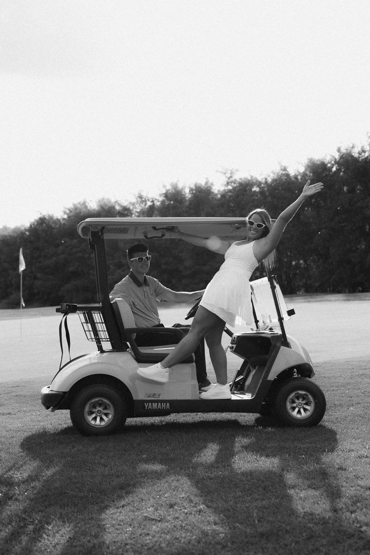 Golf carts parked on grass in a sequence showing different angles.