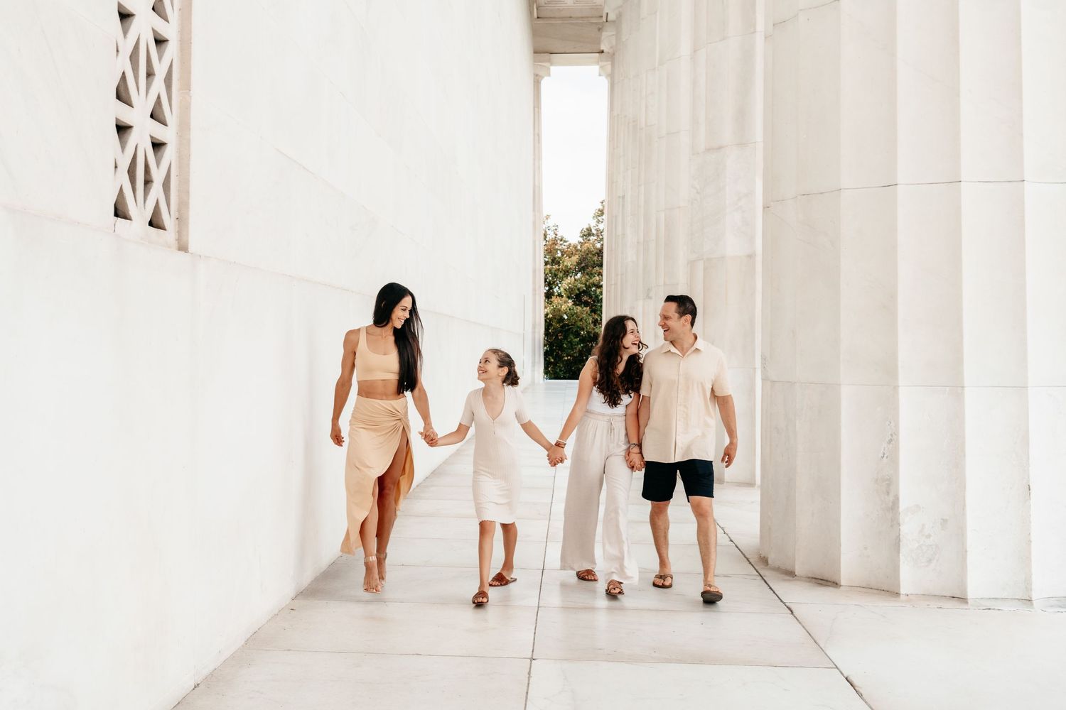 Family walking and laughing together at the Lincoln Memorial in Washington DC