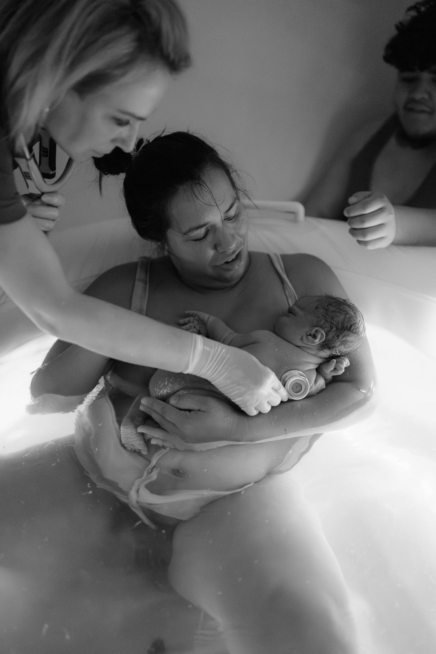 Mother holding newborn baby for the first time after birth in Frederick, MD