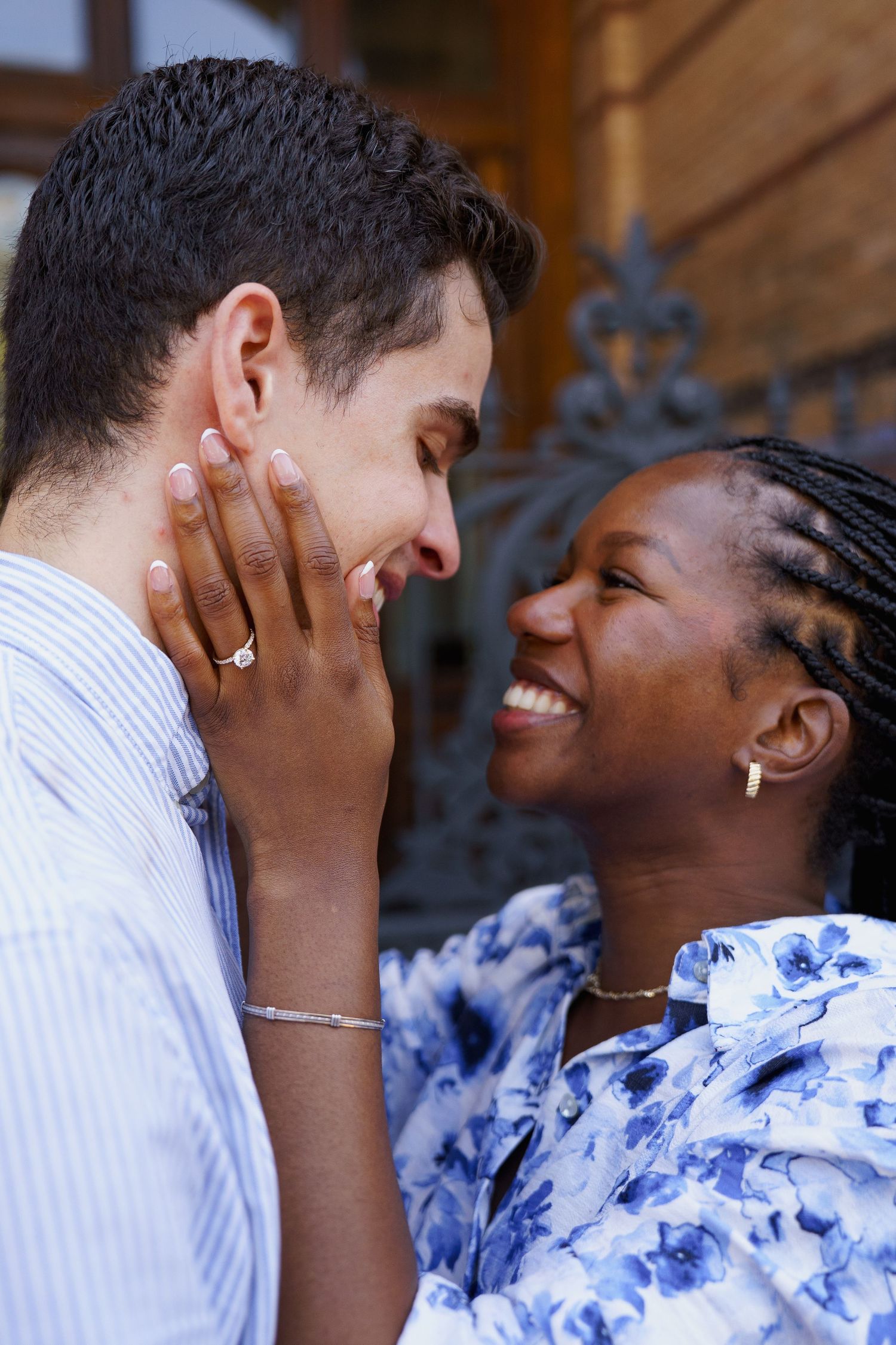 A romantic couple shares an intimate moment together showing their joyful connection during engagement session, in Washington DC