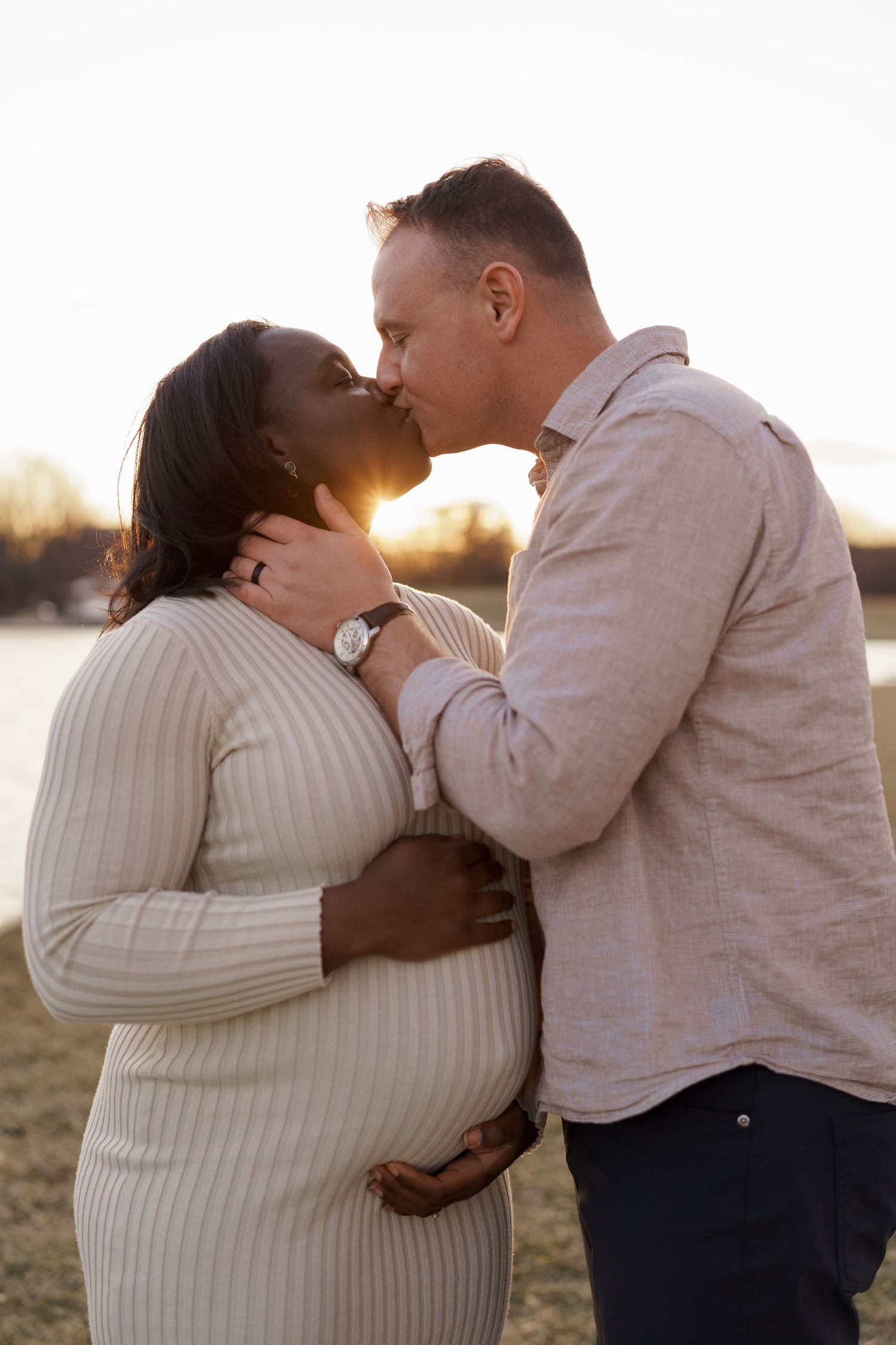 Pregnant woman in flowing dress during golden hour maternity session in Washington, DC
