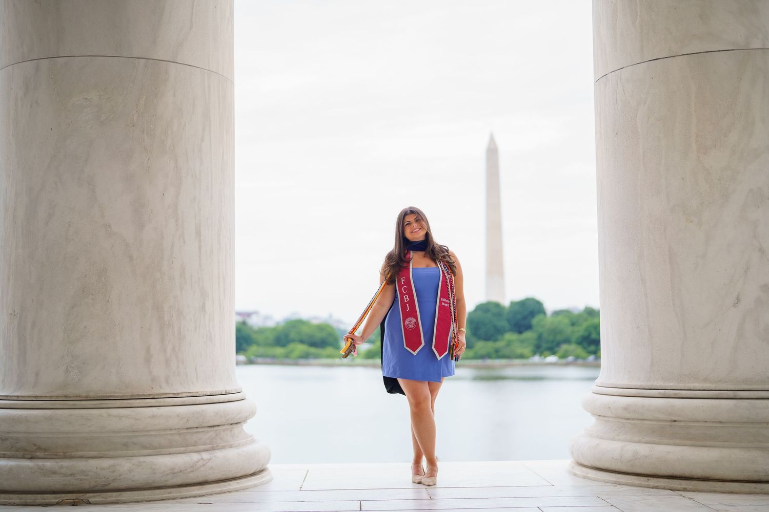 Graduation session at the Jefferson Memorial with the Washington Monument visible, in Washington DC