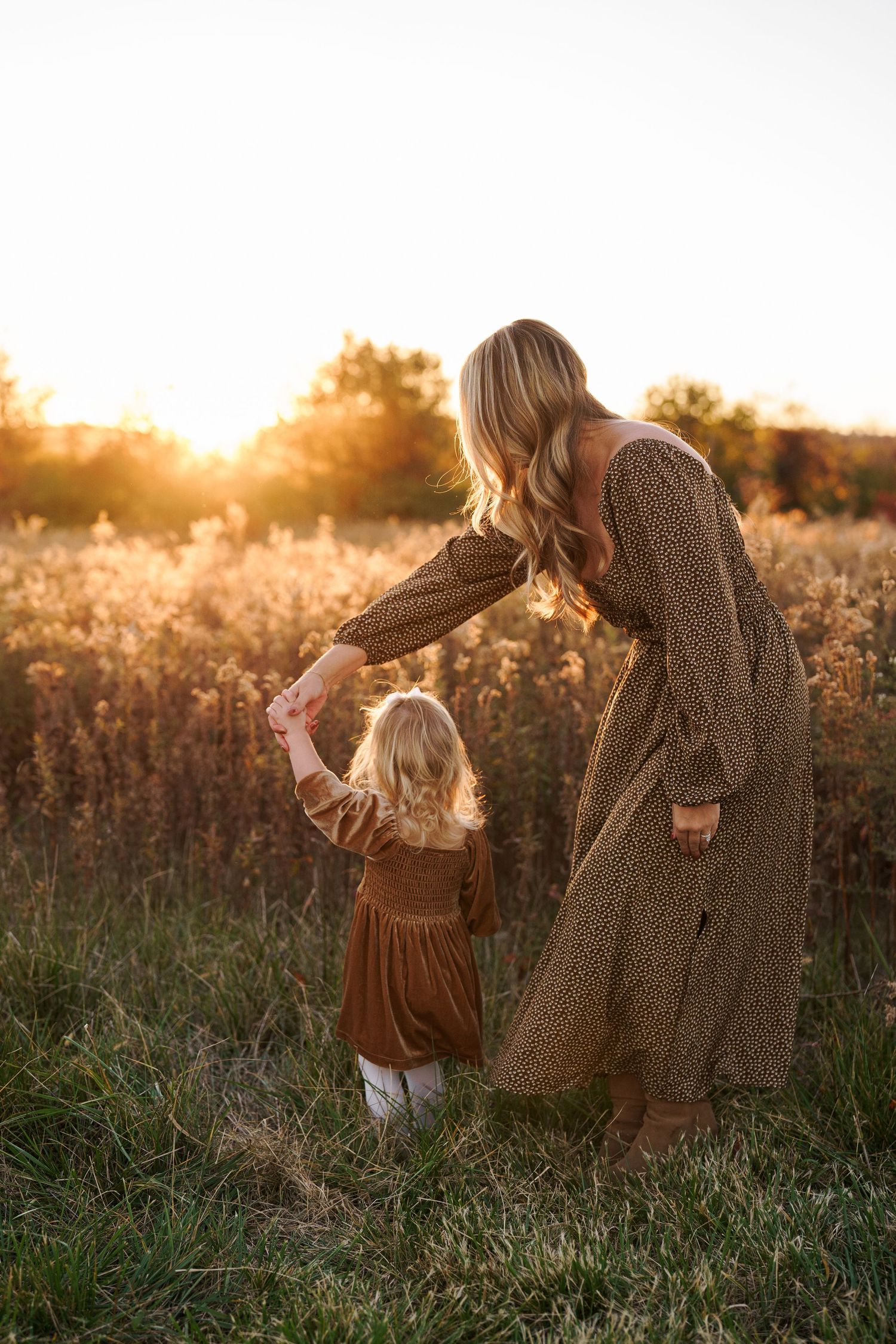 Family photography session in a golden field at sunset in Frederick, Maryland