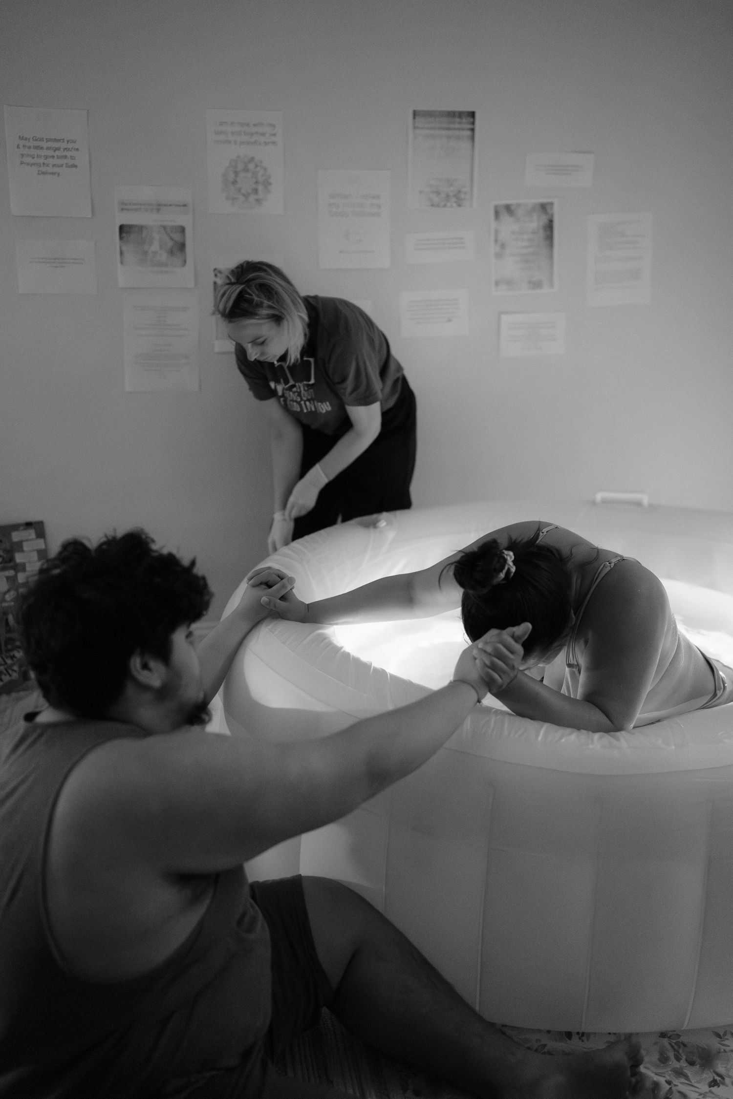 Midwife assisting during a natural home birth in Frederick, MD
