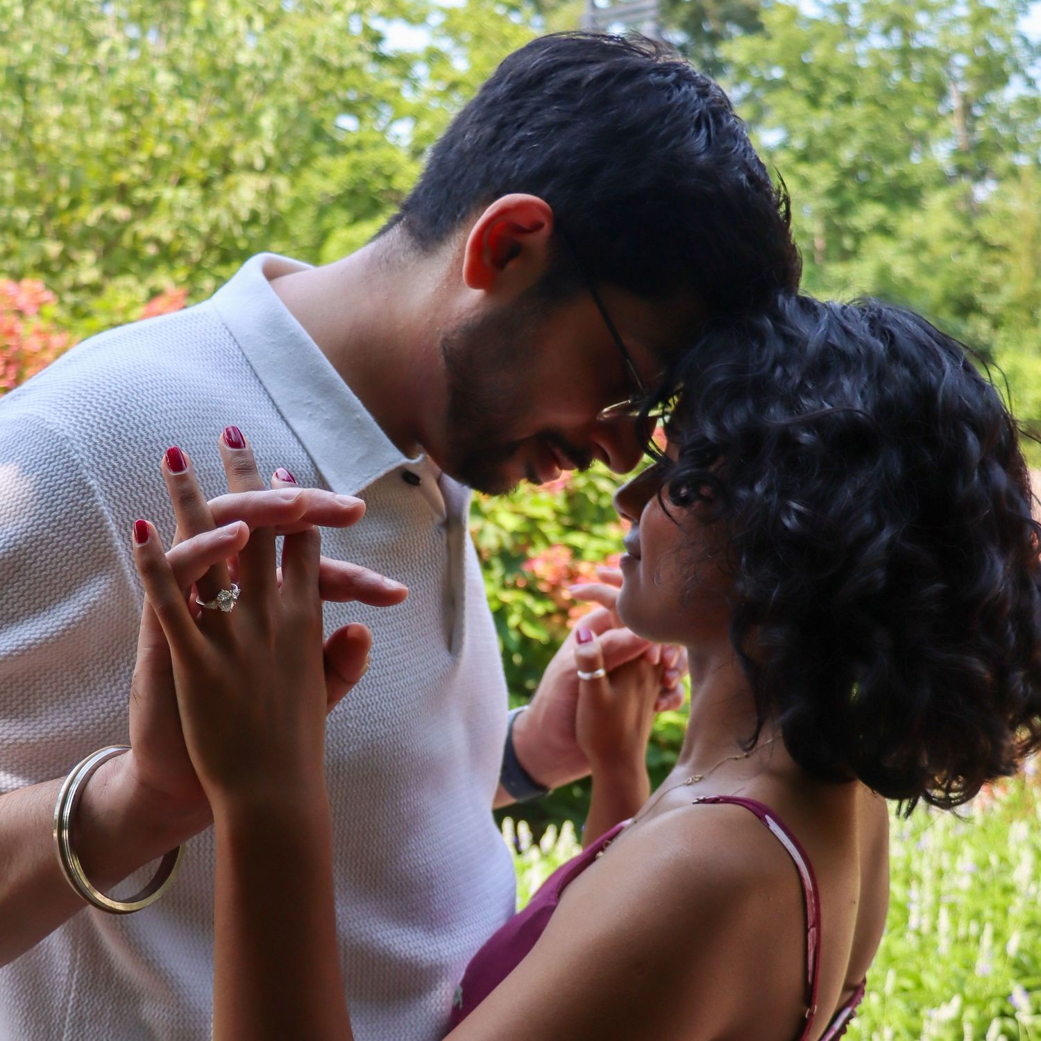 Newly engaged couple shares a romantic moment at the Cincinnati Zoo during a surprise proposal photographed by a local engagement photograph