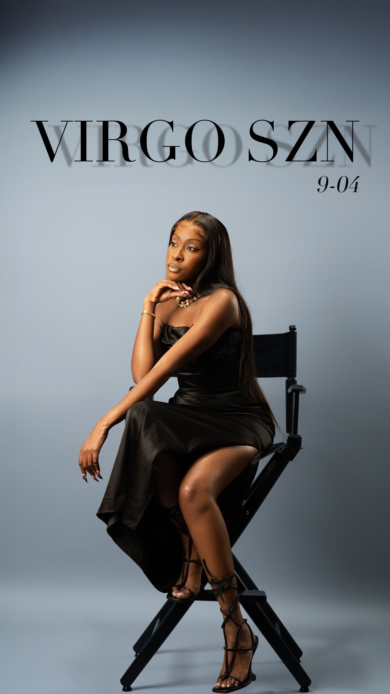 Woman in black dress poses in director chair for Virgo SZN 9-04.