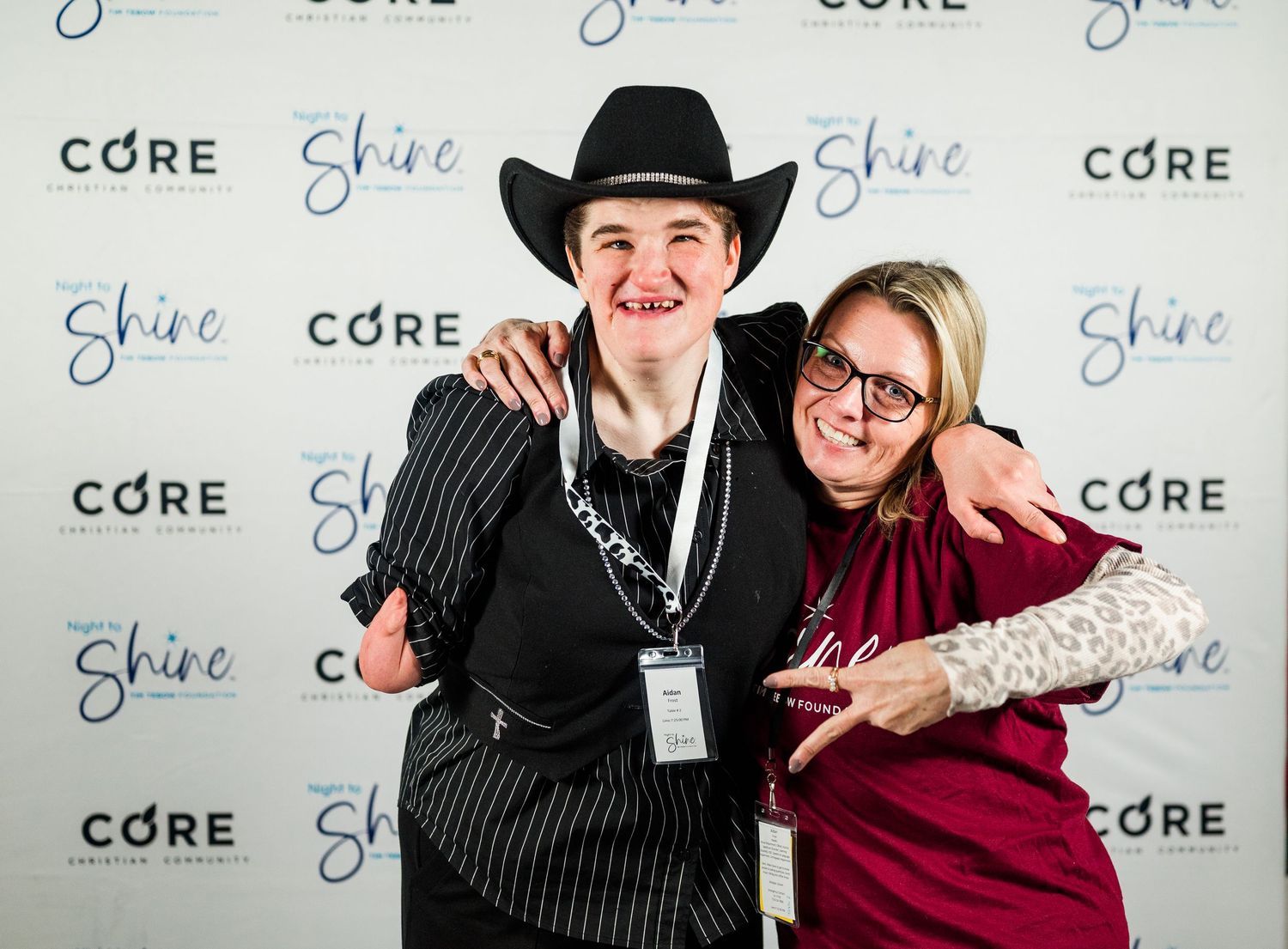 Smiling guests pose at Night to Shine in Colorado, captured in joyful event photography celebrating connection, inclusion, and unforgettable