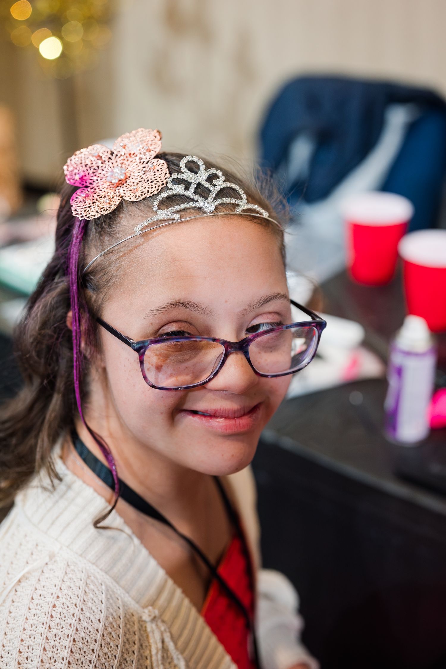Smiling guest wearing a tiara at Night to Shine event, captured in joyful, inclusive event photography celebrating confidence, beauty, and c