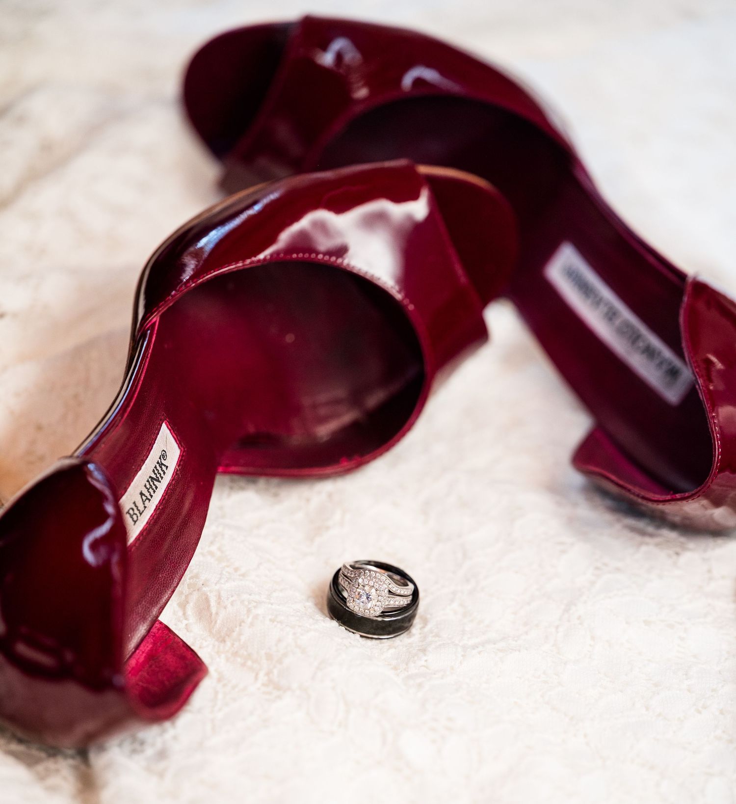 Red bridal shoes with wedding rings, elegant detail photography, bridal accessories Colorado wedding photographer