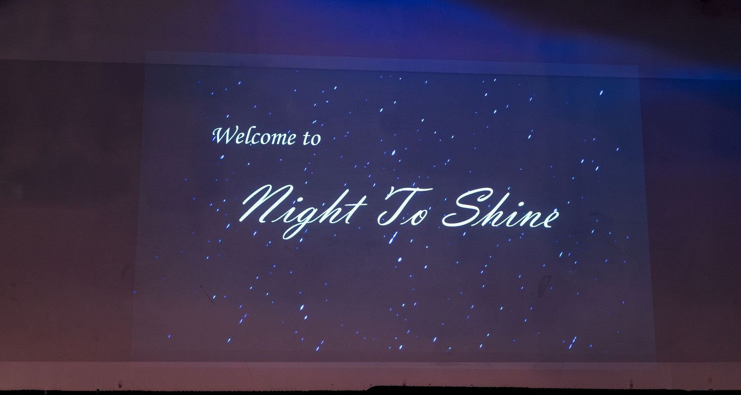 Welcome sign for Night to Shine event in Colorado, captured in event photography showcasing a joyful, inclusive celebration atmosphere.