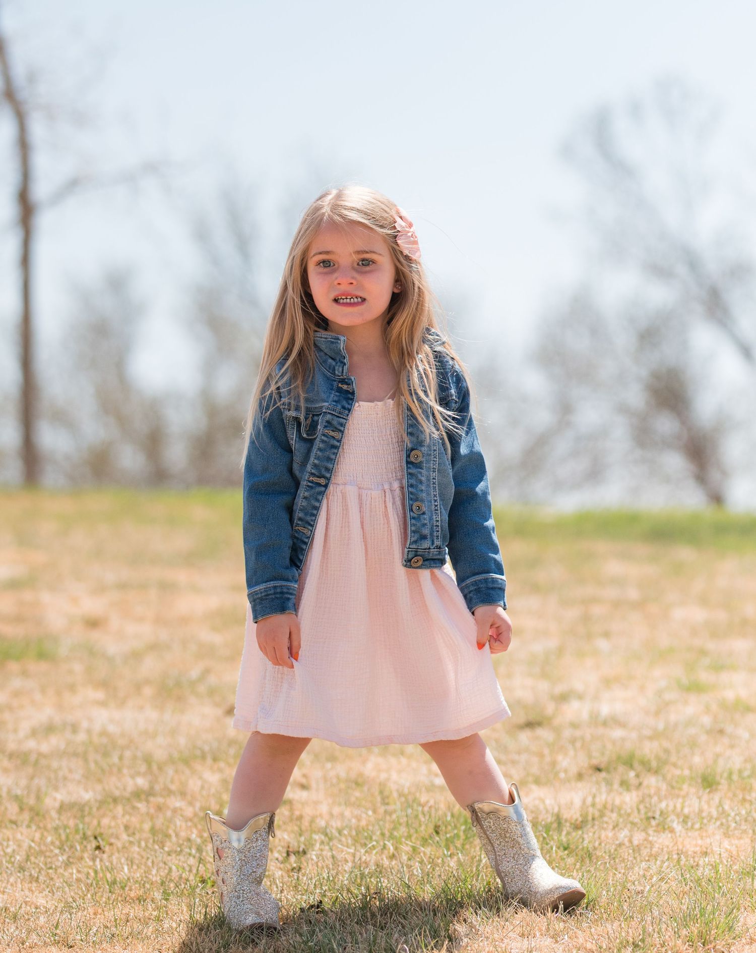 Portrait of 4 year old girl in pink dress and denim jacket, outdoor Colorado family photography, natural light Denver photographer spring Po