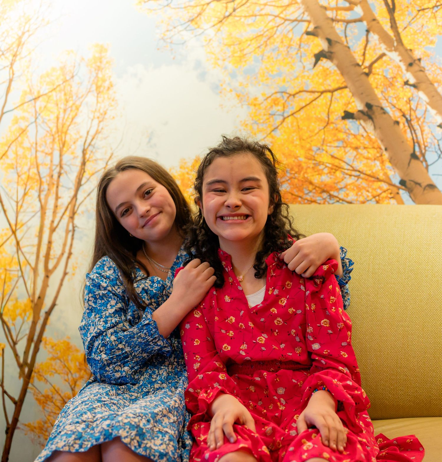 Portrait of two girls smiling together, candid Colorado event photography, natural light Denver photographer