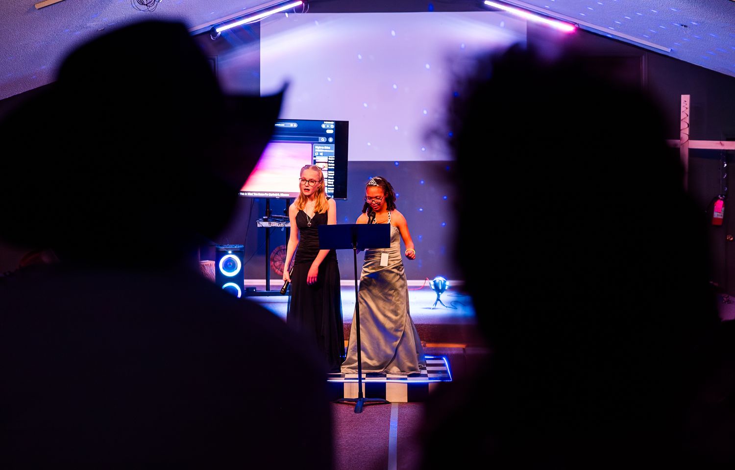 Guests performing on stage at Night to Shine event, capturing a memorable moment of confidence, talent, and inclusive celebration under vibr