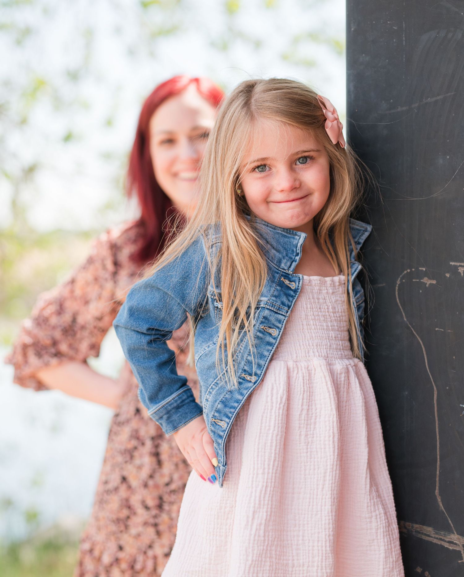 Mommy and me photo of smiling 4 year old girl with mom in background, natural light Colorado family photography
Candid mommy and me session