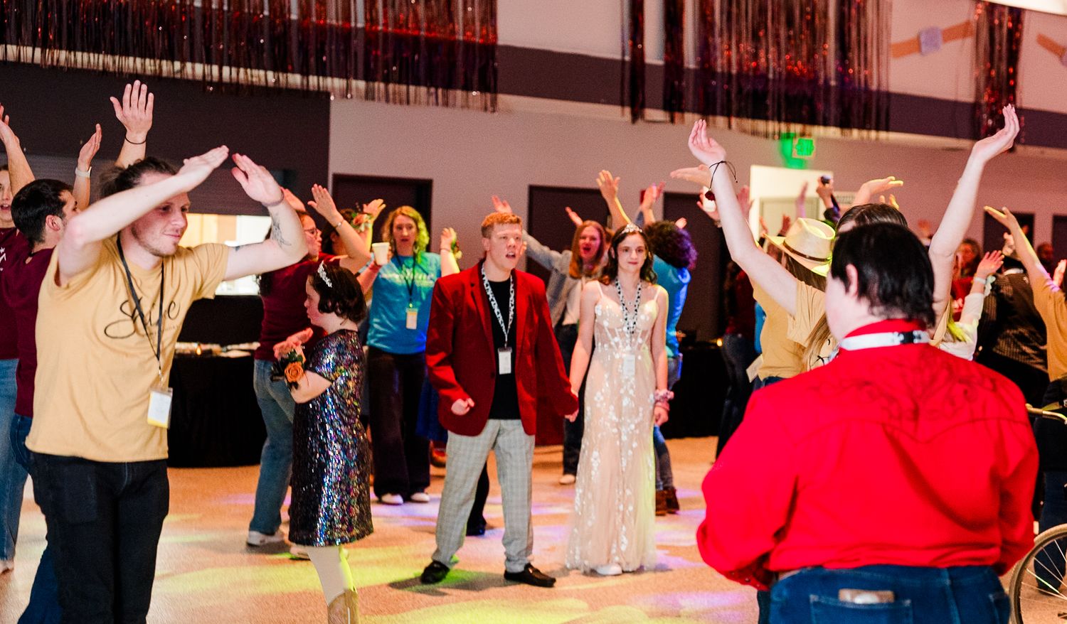 Guests dancing together at a Night to Shine event in Colorado, captured in candid event photography celebrating connection, joy, and communi