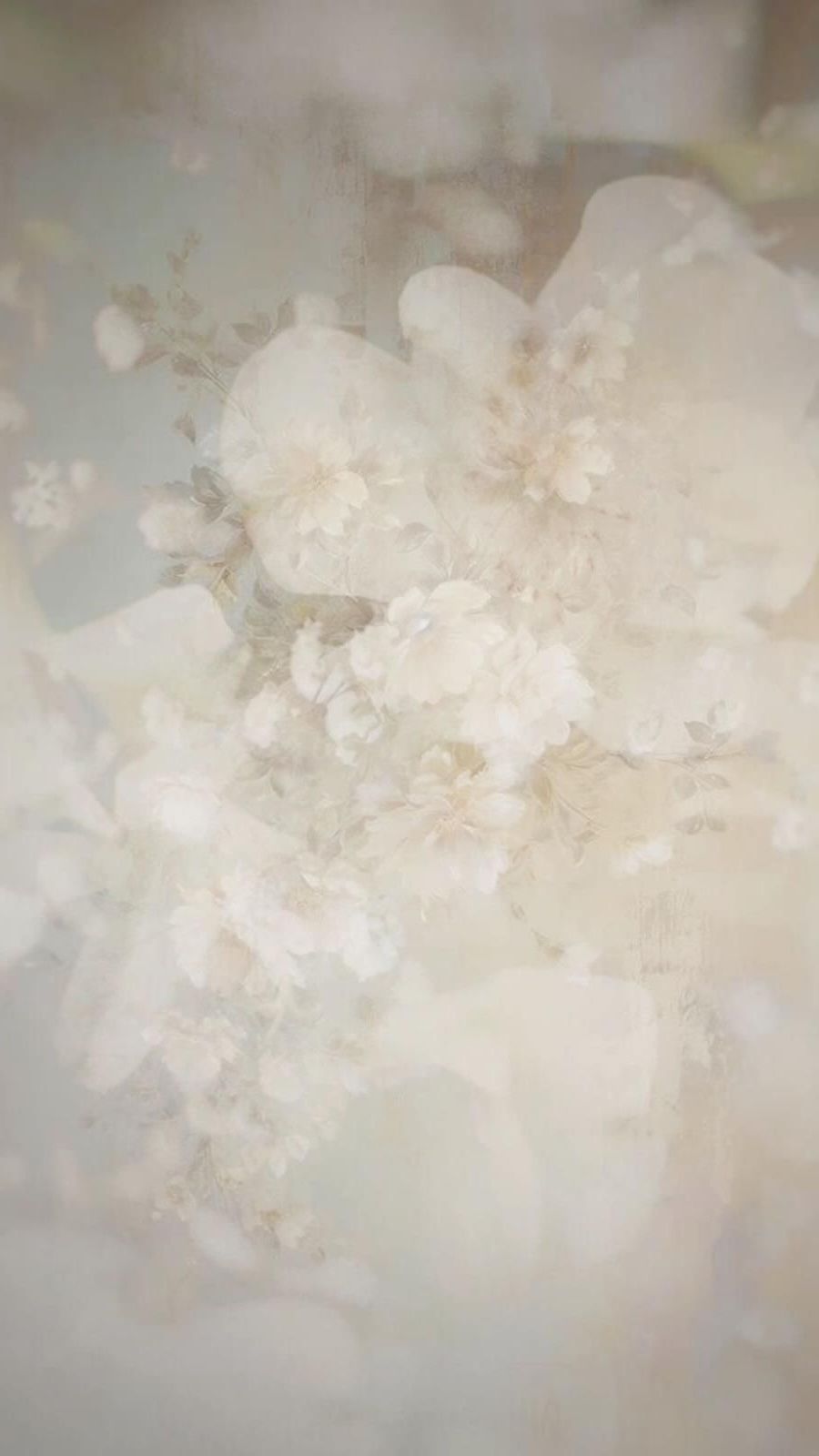 Ethereal white and cream colored abstract background with soft floral textures.