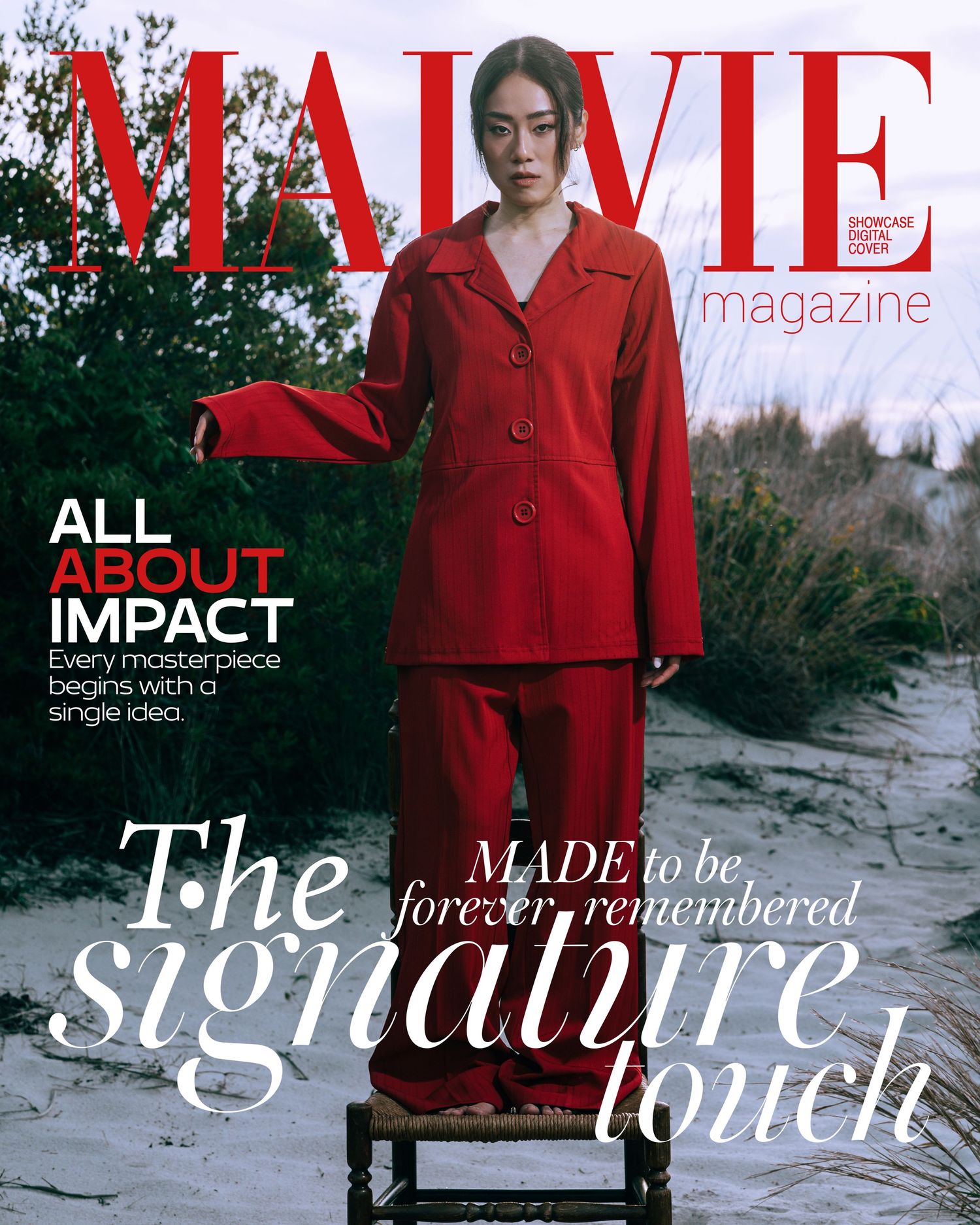 Woman in red suit on MALVIE Magazine cover with text All About Impact and The Signature Touch.