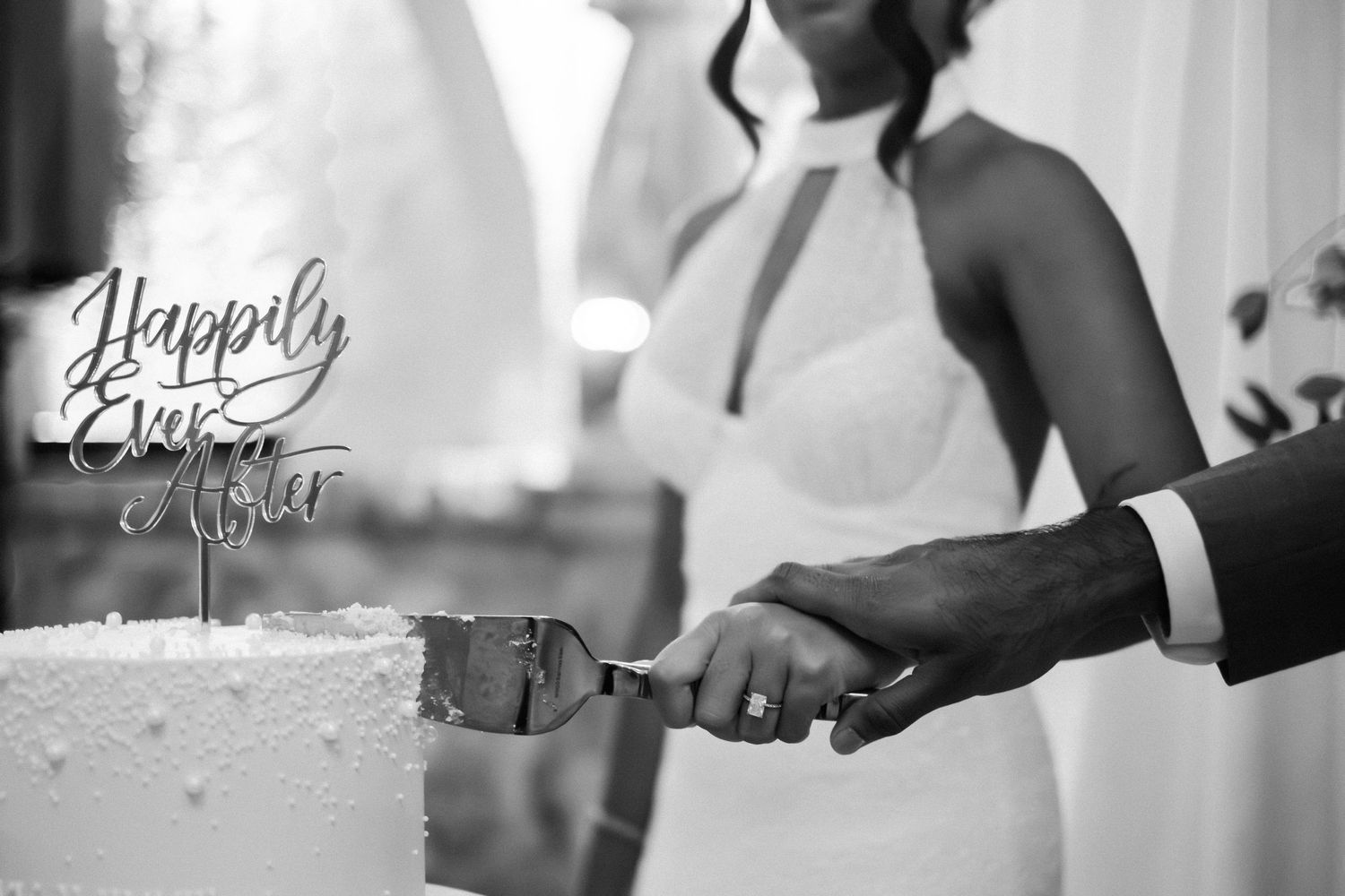 Black and white wedding reception details with elegant table settings and decor.