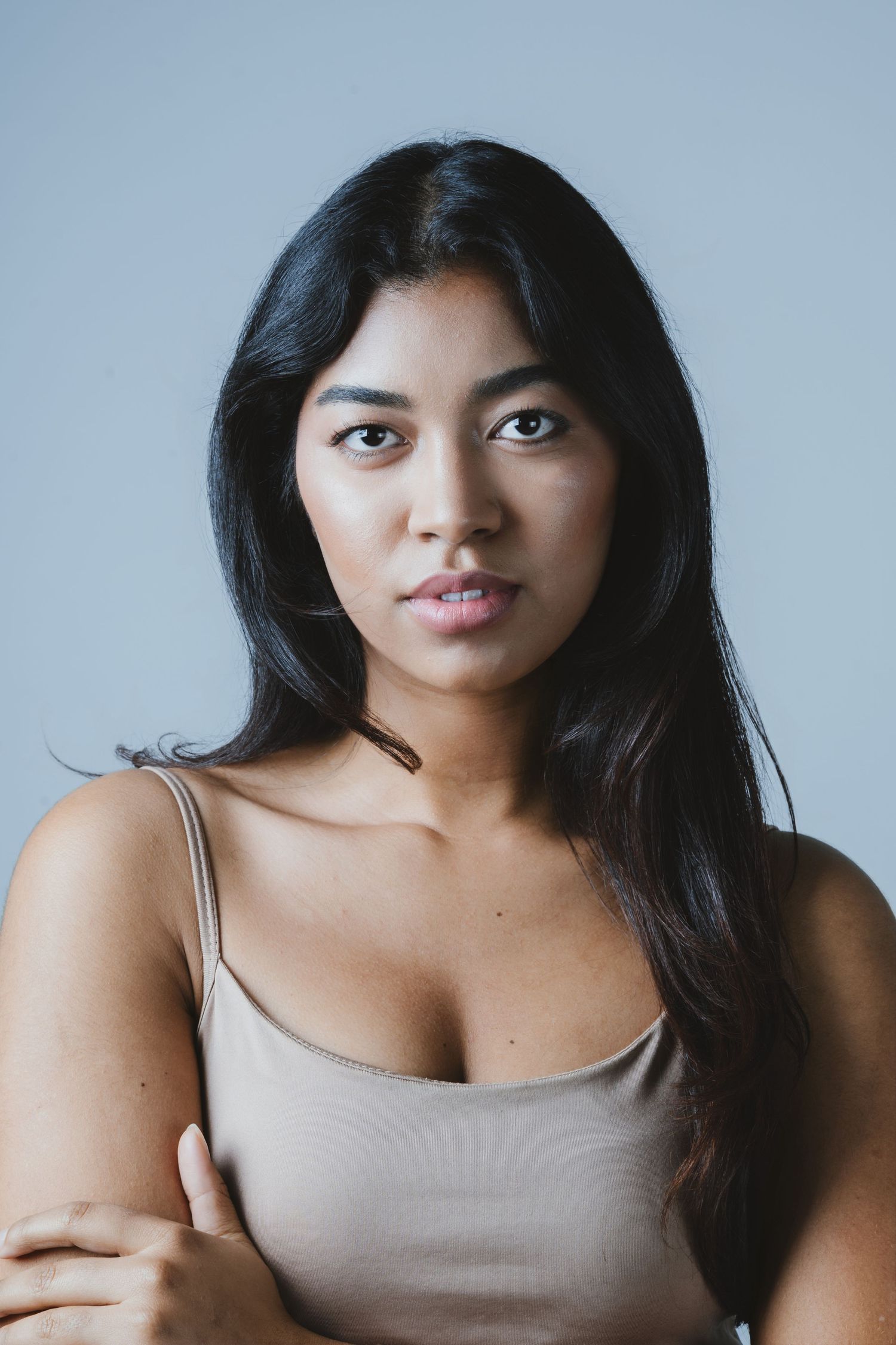 A series of portraits showing different poses and expressions against a light background.