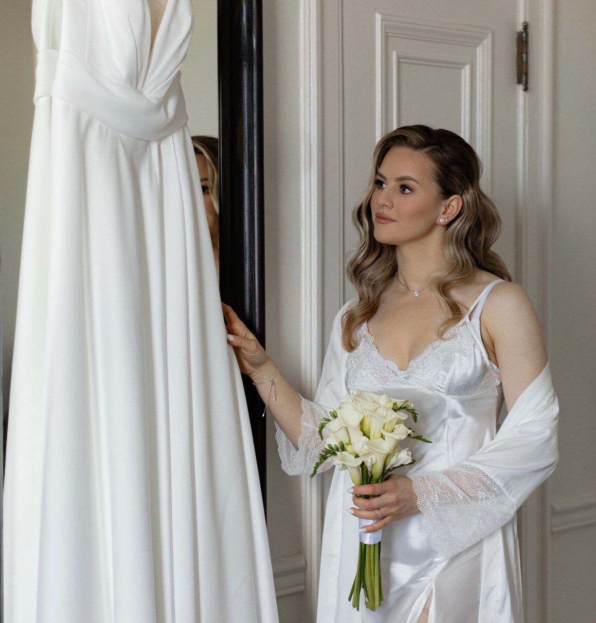 Bride getting ready on wedding morning, natural soft glam makeup by Natalia MUA in Winnipeg.