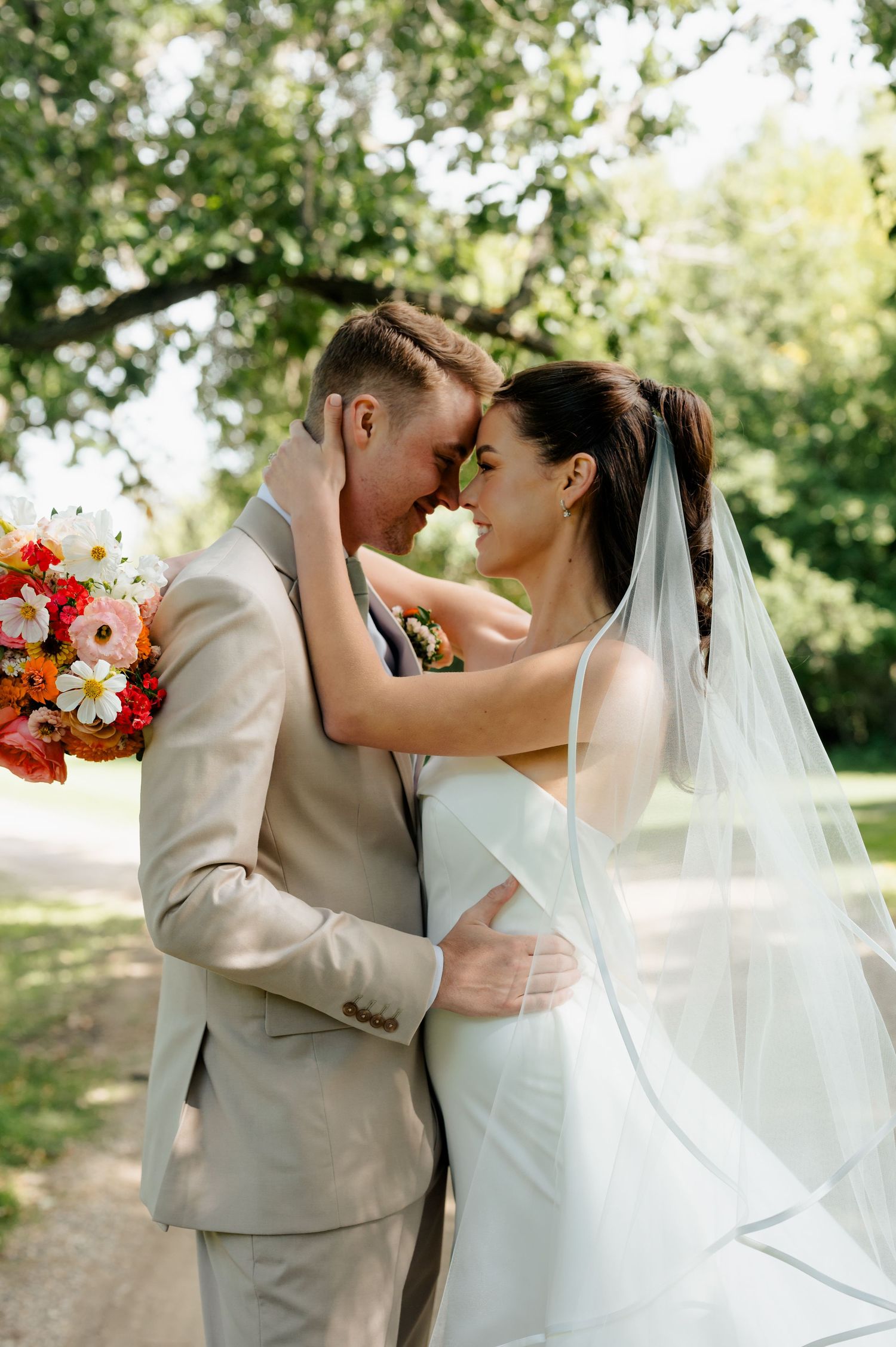 Bride and groom on wedding day, makeup by Natalia MUA, timeless bridal beauty Winnipeg.