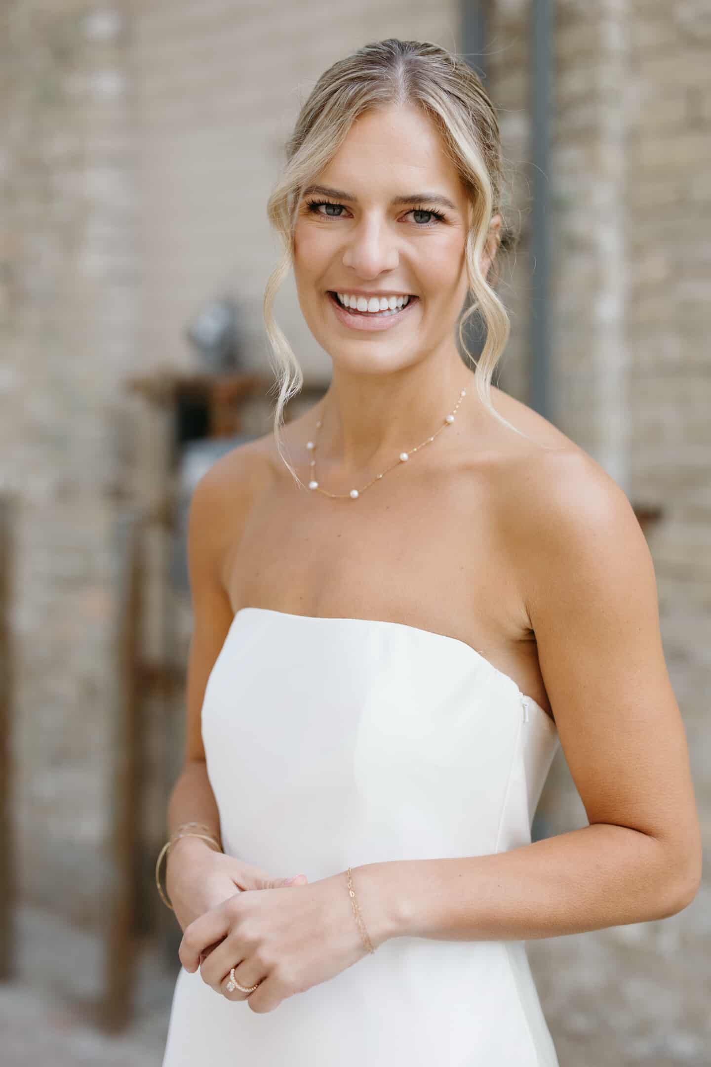 Bride with natural radiant makeup by Natalia MUA, elegant soft glam look for wedding day in Winnipeg.