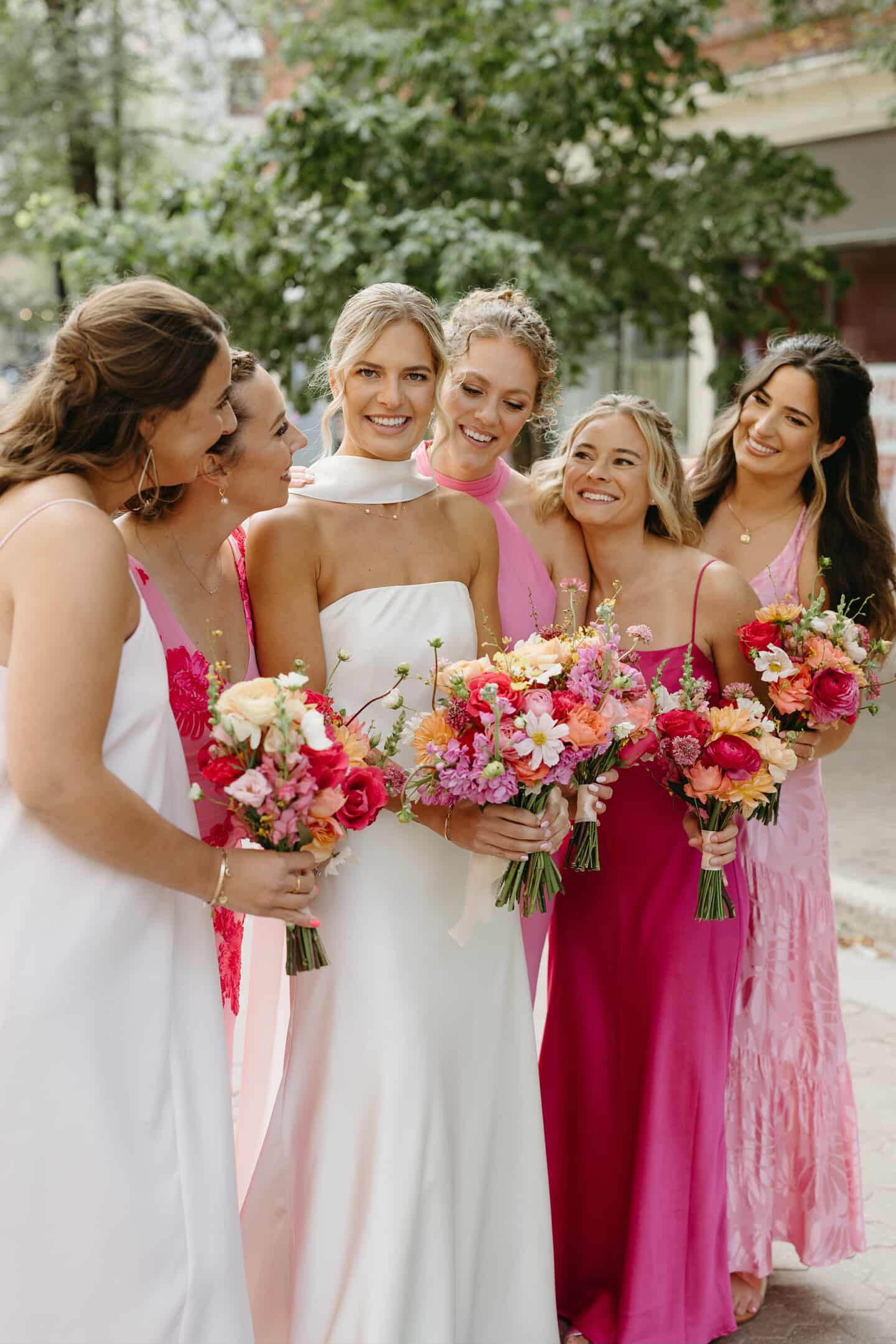 Bridal party makeup by Natalia MUA, bright and romantic pink tones for bridesmaids and bride in Winnipeg.
