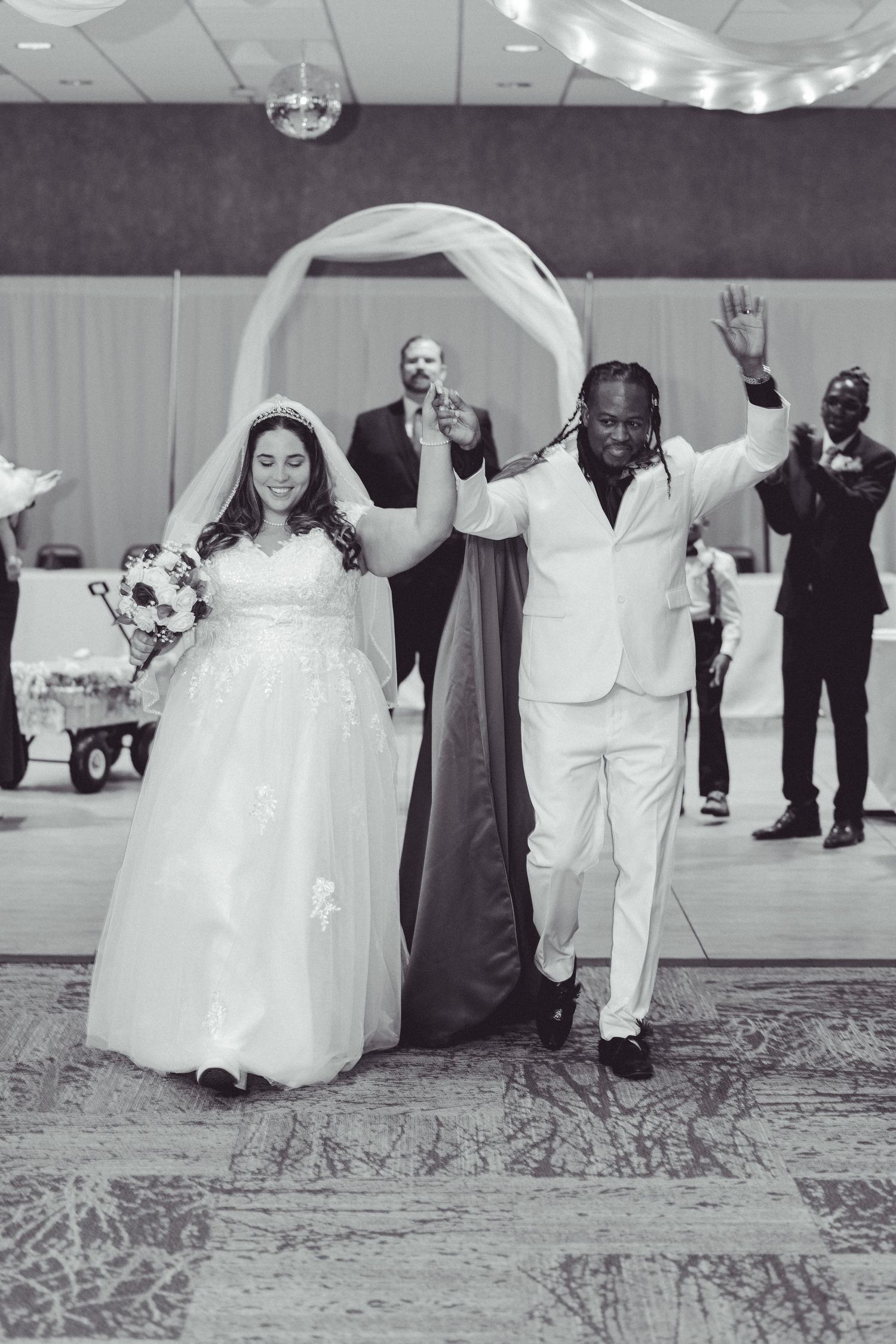Black and white photo sequence showing wedding reception dance moves on a patterned carpet floor.