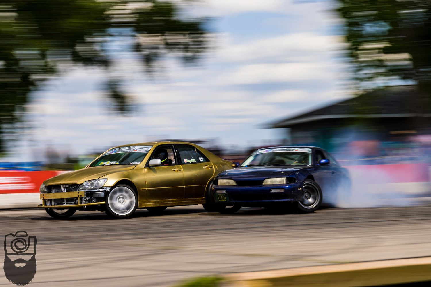 Multiple BMW cars drifting in formation on a race track with motion blur effects.