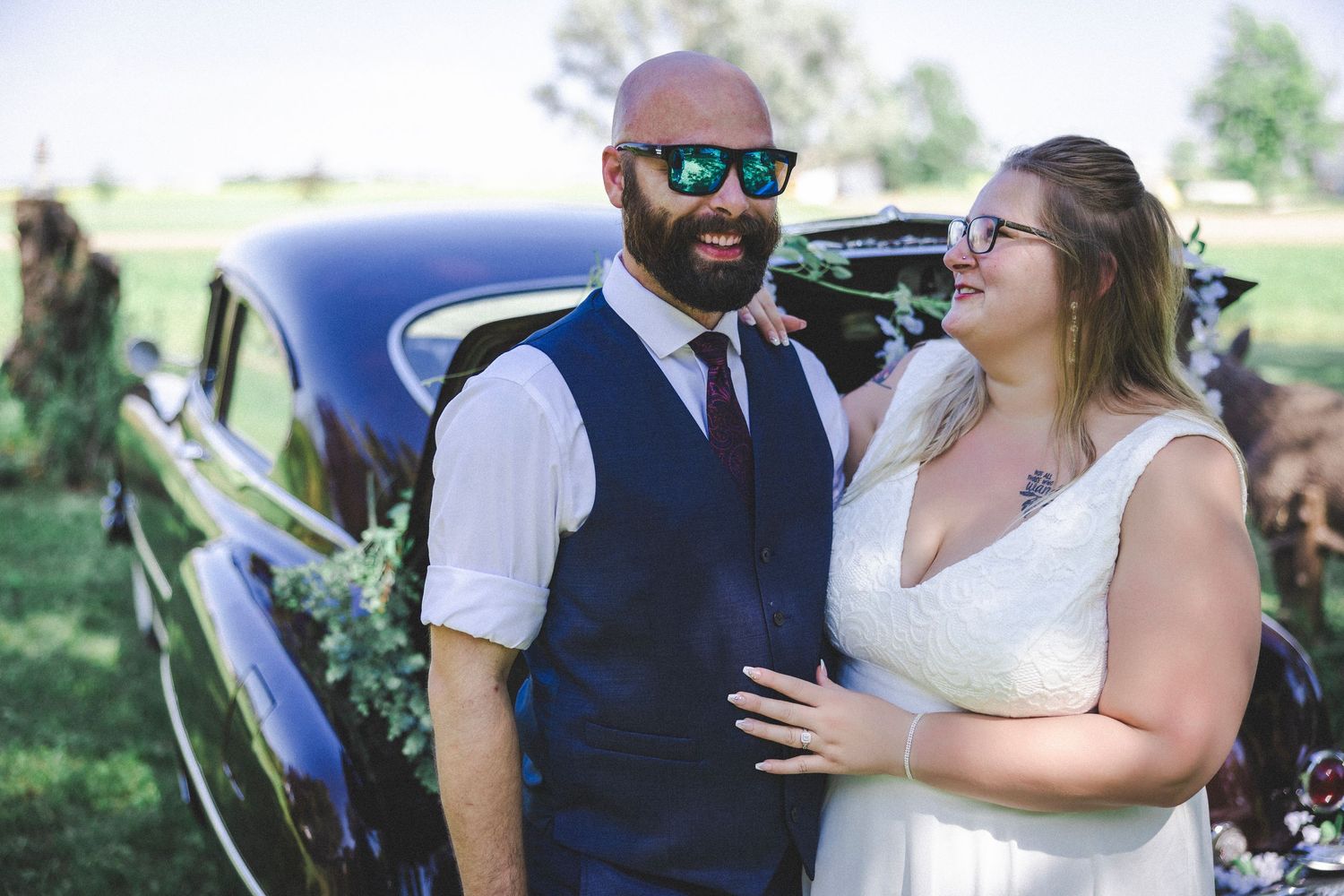 Wedding celebration photos showing joyful moments with a classic car in the background.