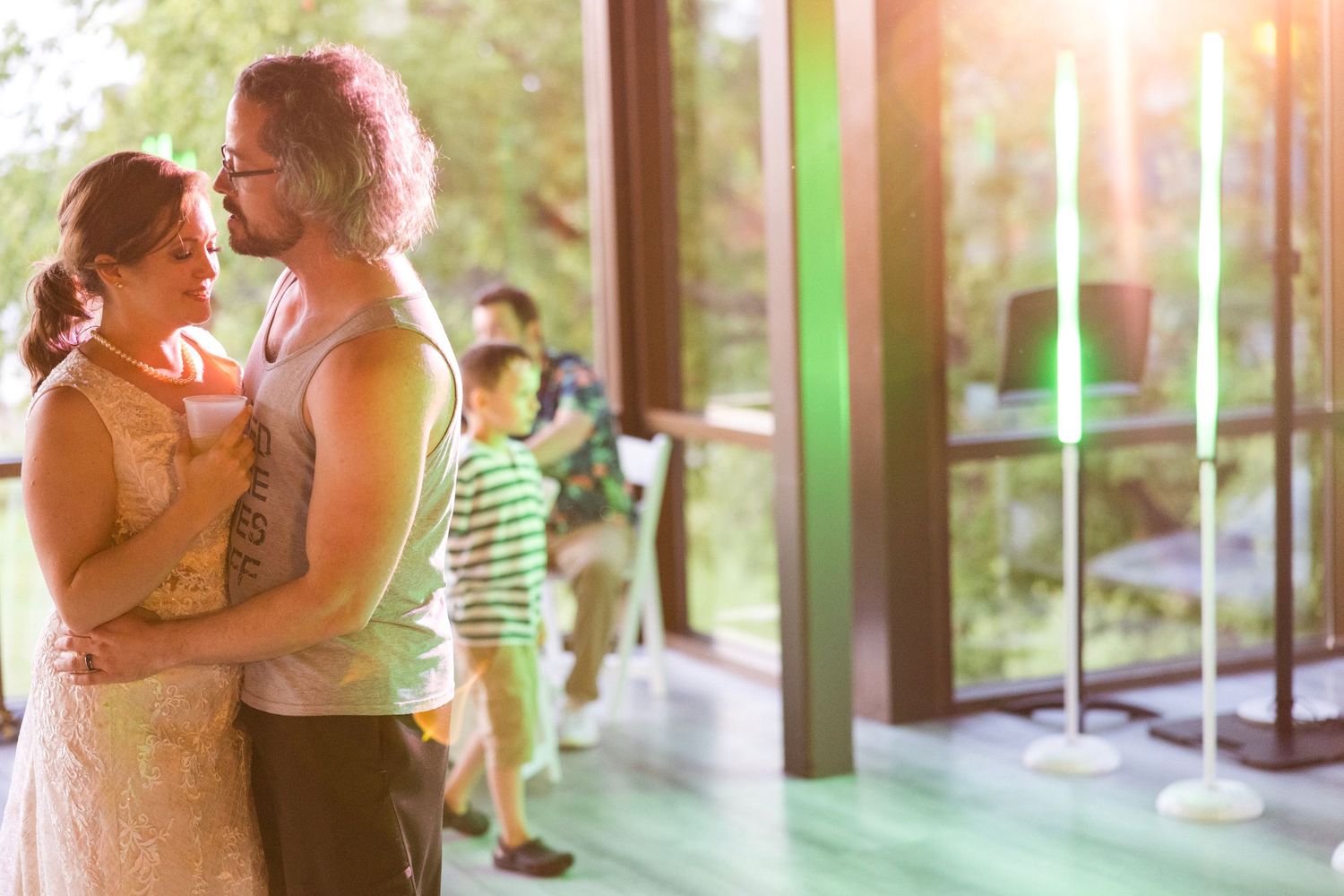Series of romantic moments captured in warm sunlight through glass windows.