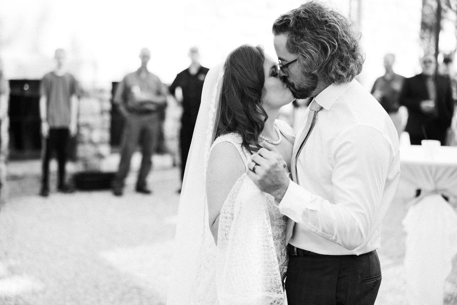 Candid black and white wedding moments captured during the reception celebration.