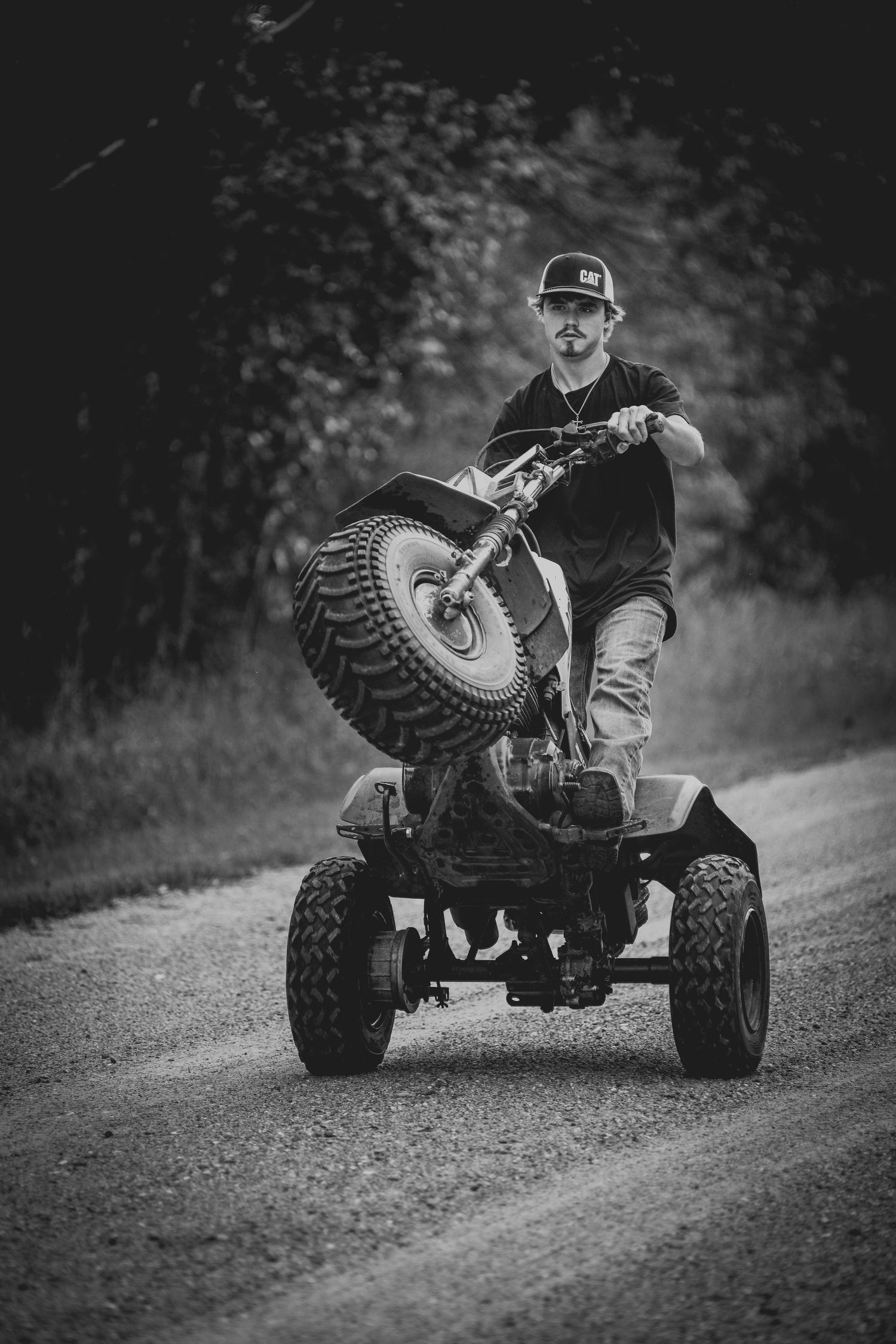 Black and white action shots of ATV rider on dirt trail.