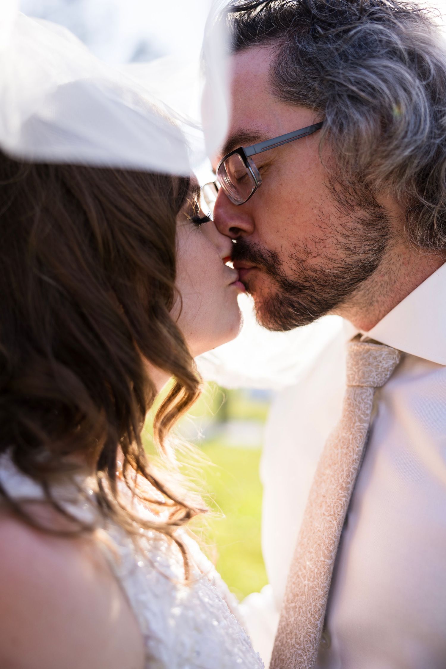 Tender close-up shots of couple sharing intimate moments in soft lighting.