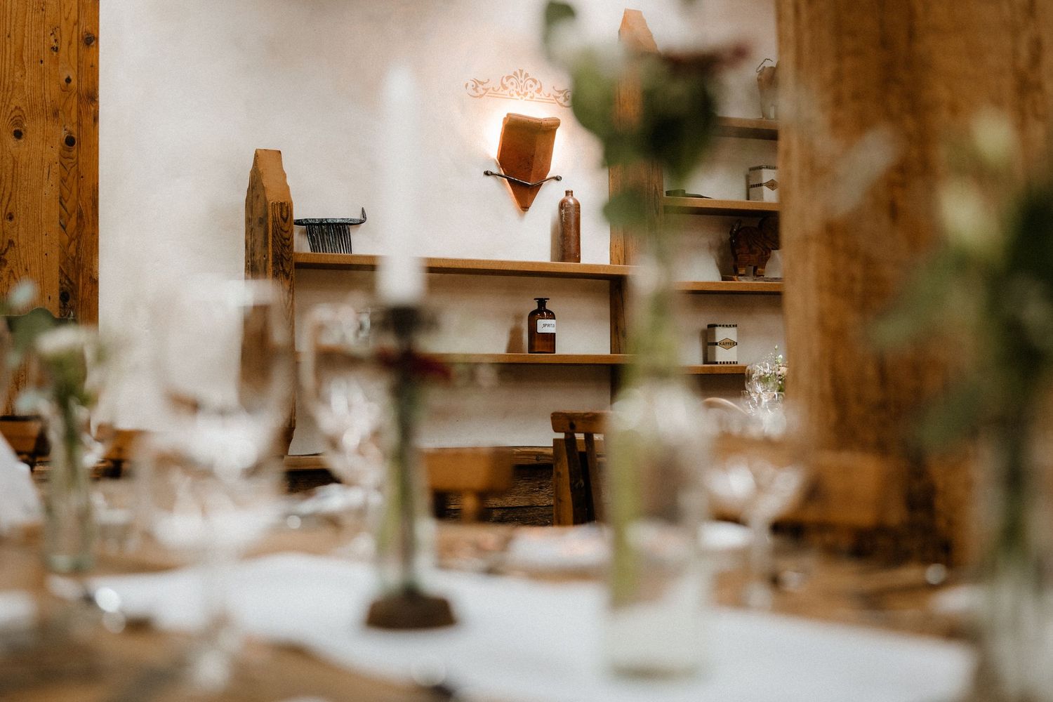 Close-up view of rustic wedding reception decor details with soft bokeh effect.