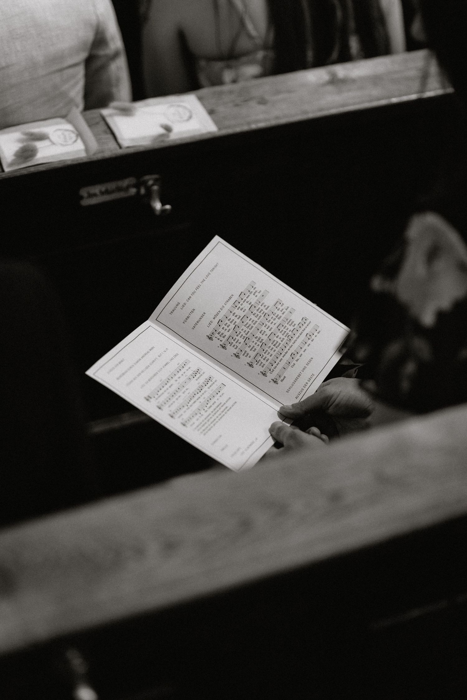 Black and white detail shot of wedding ceremony program or order of service.