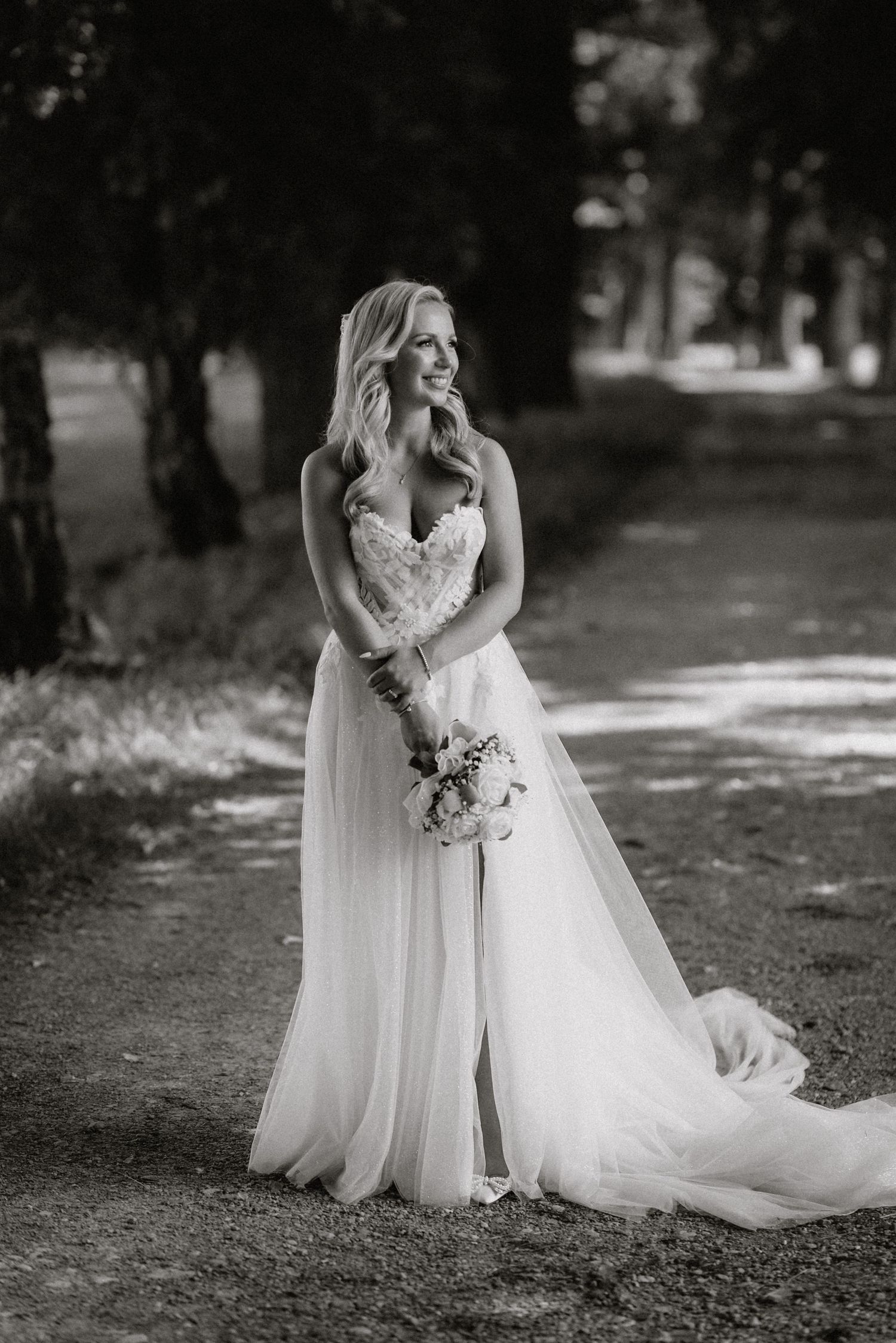 Black and white bridal portraits showing elegant details of lace dress and bouquet.