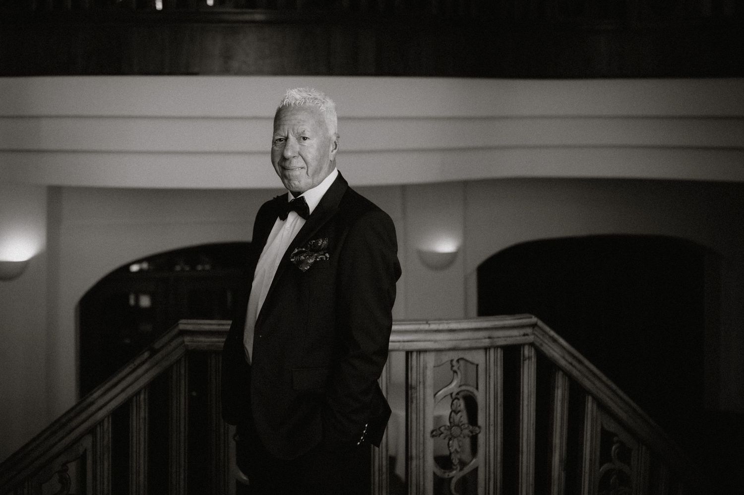 Black and white photograph showing elegant wedding ceremony moments.