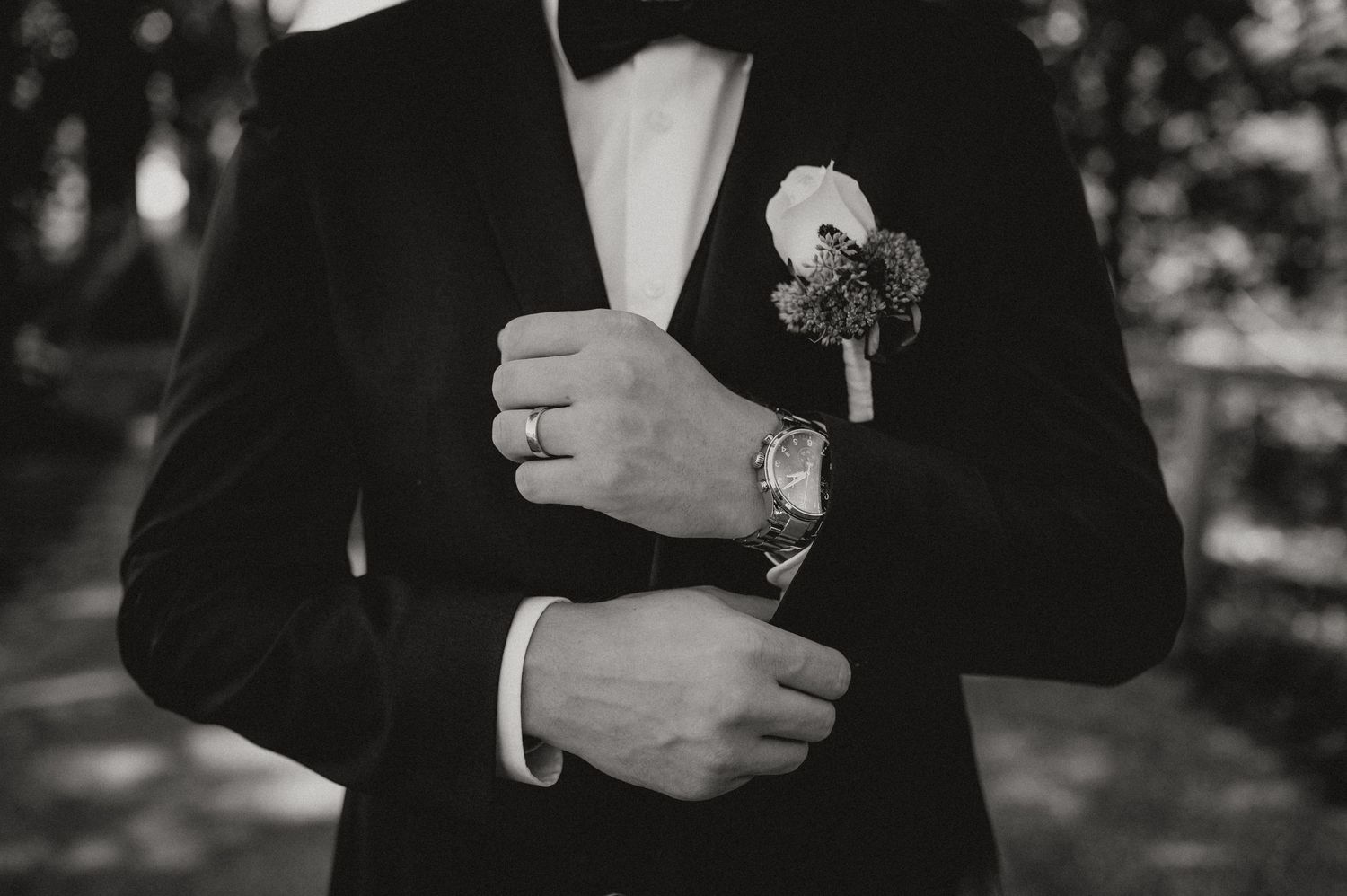 Detail shots of formal attire showing cufflinks and suit jacket.