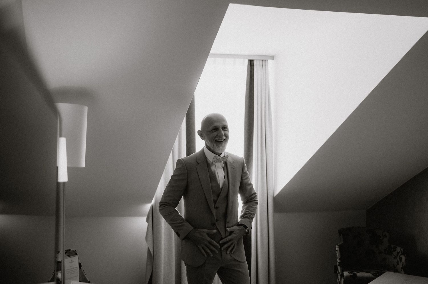 Black and white photo showing preparations in an attic-style room.