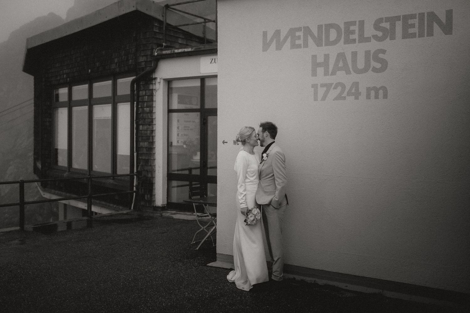 Black and white architectural signage showing Wendelstein Haus text on a building wall.