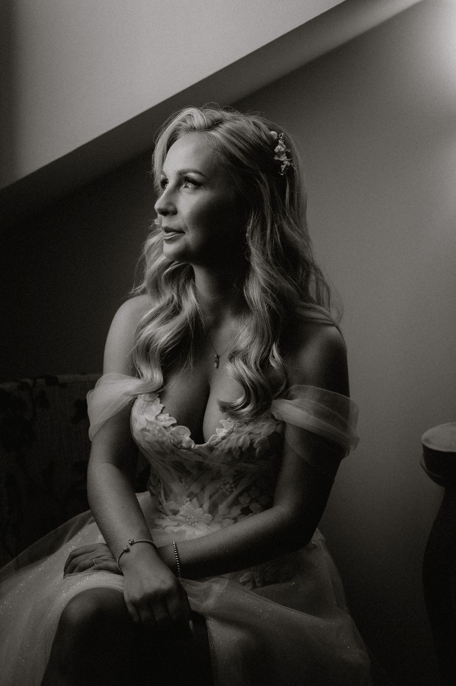 Moody black and white portraits capture intimate moments of bridal preparation.