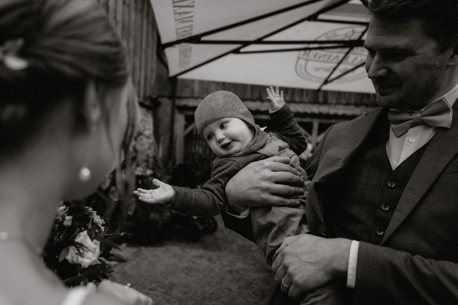 Intimate black and white capture of wedding celebration moments.