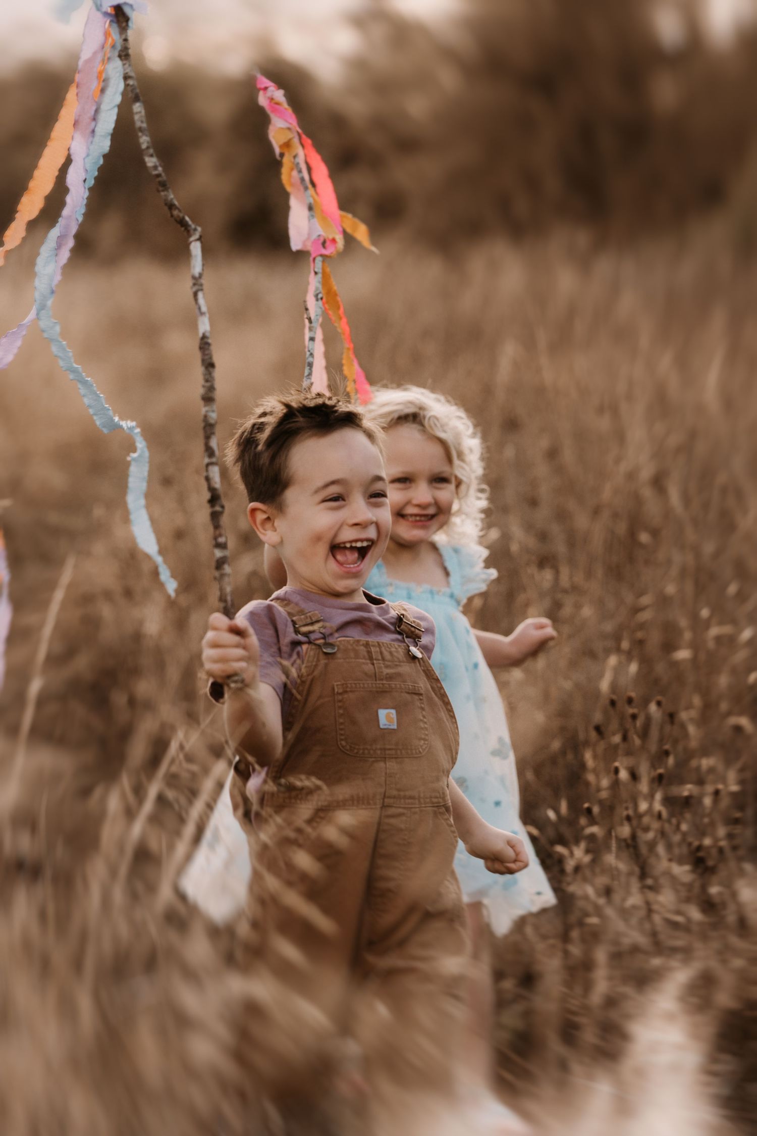 kids runnig with ribbons on sticks in moira during a photsohoot with soft sotiees by angela